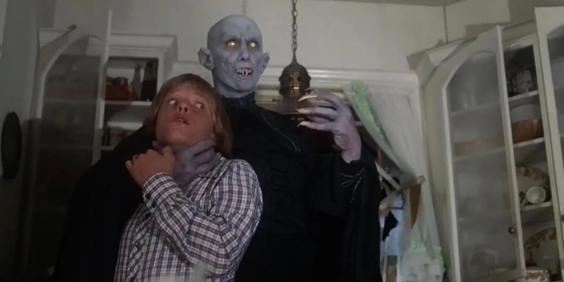 Reggie Nalder threatens Lance Kerwin in Salem's Lot. Reggie Nalder threatens Lance Kerwin in Salem's Lot.