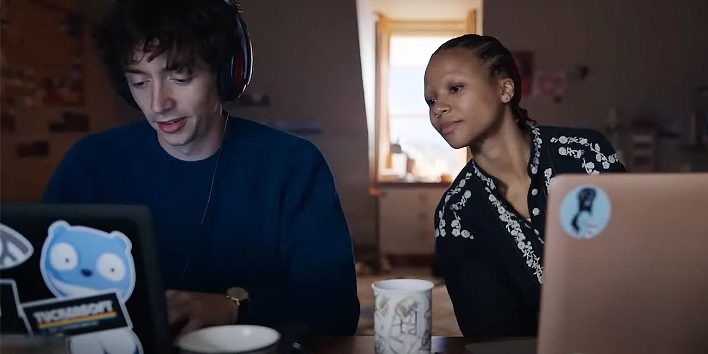Davis and Pia on laptops in Black Mirror episode Loch Henry. Davis and Pia on laptops in Black Mirror episode Loch Henry.