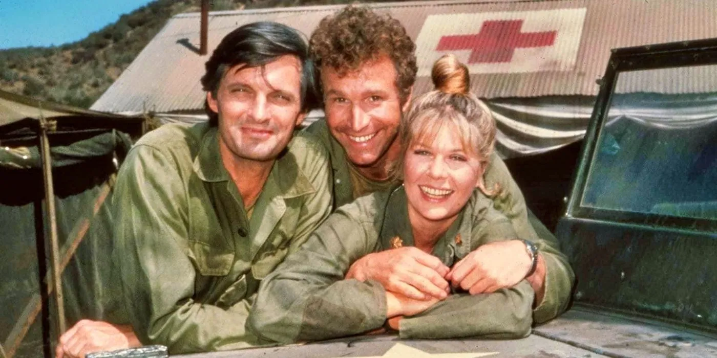 Cast of M*A*S*H leaning on a military truck Cast of M*A*S*H leaning on a military truck
