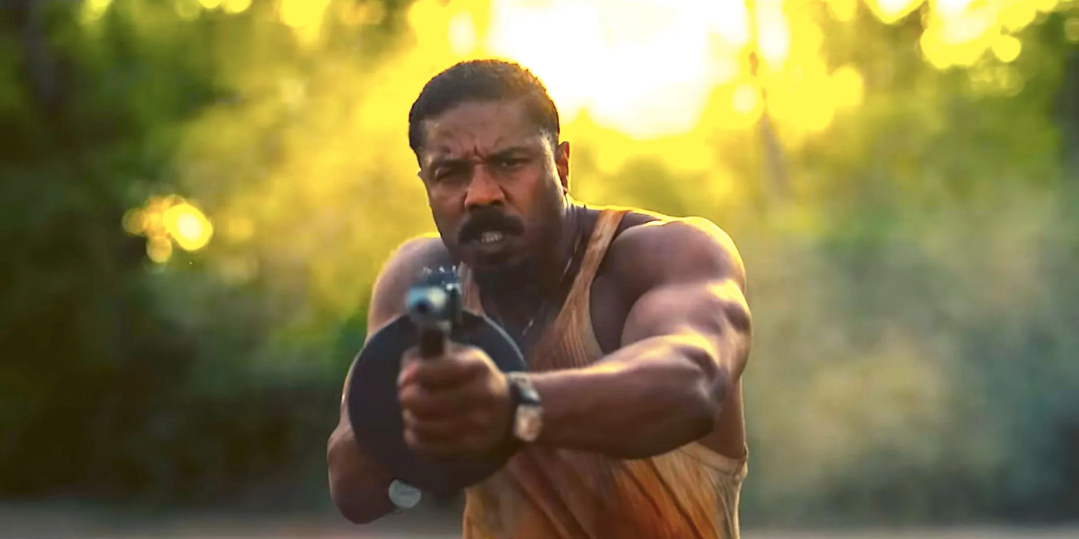 Michael B. Jordan aiming a gun in Sinners Michael B. Jordan aiming a gun in Sinners