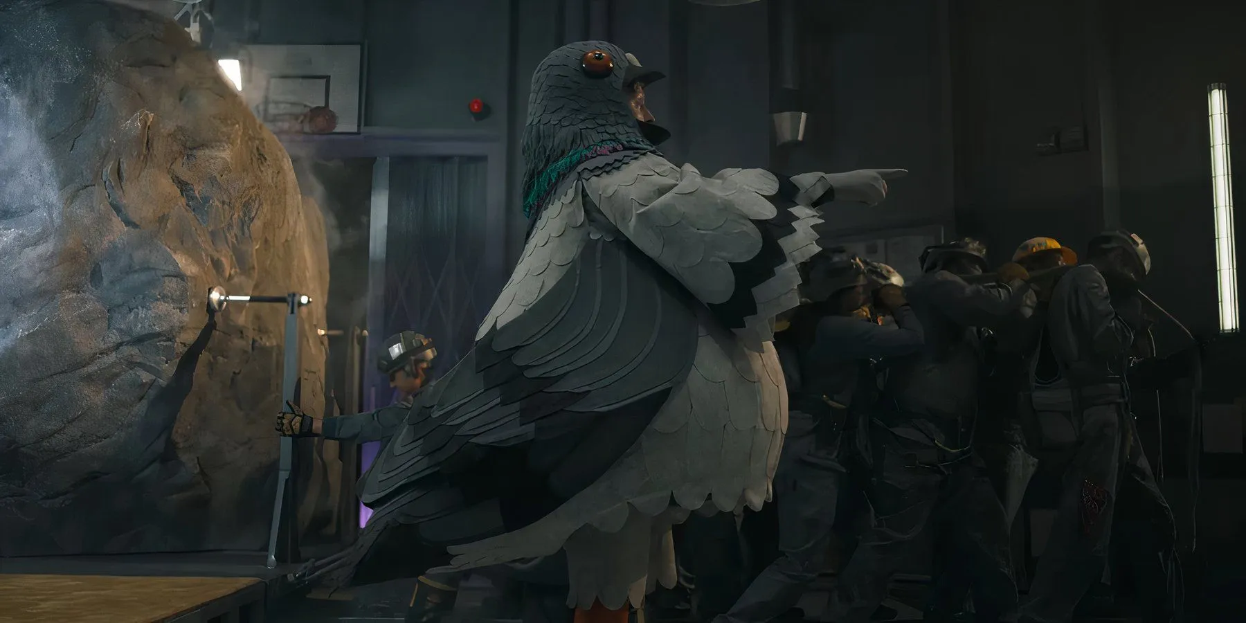 A man in a pigeon suit pointing in Mickey 17