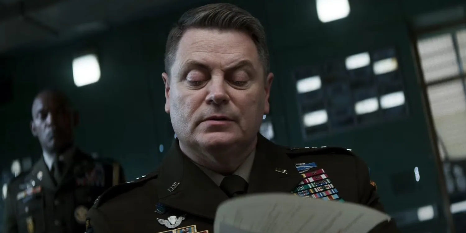 Nick Offerman reading a file in Mission Impossible The Final Reckoning