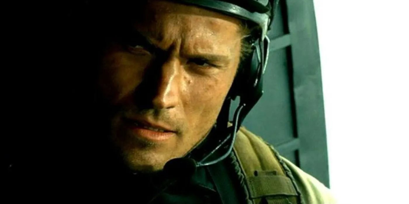 Delta Force operator Gary Gordon perched in a Black Hawk helicopter.