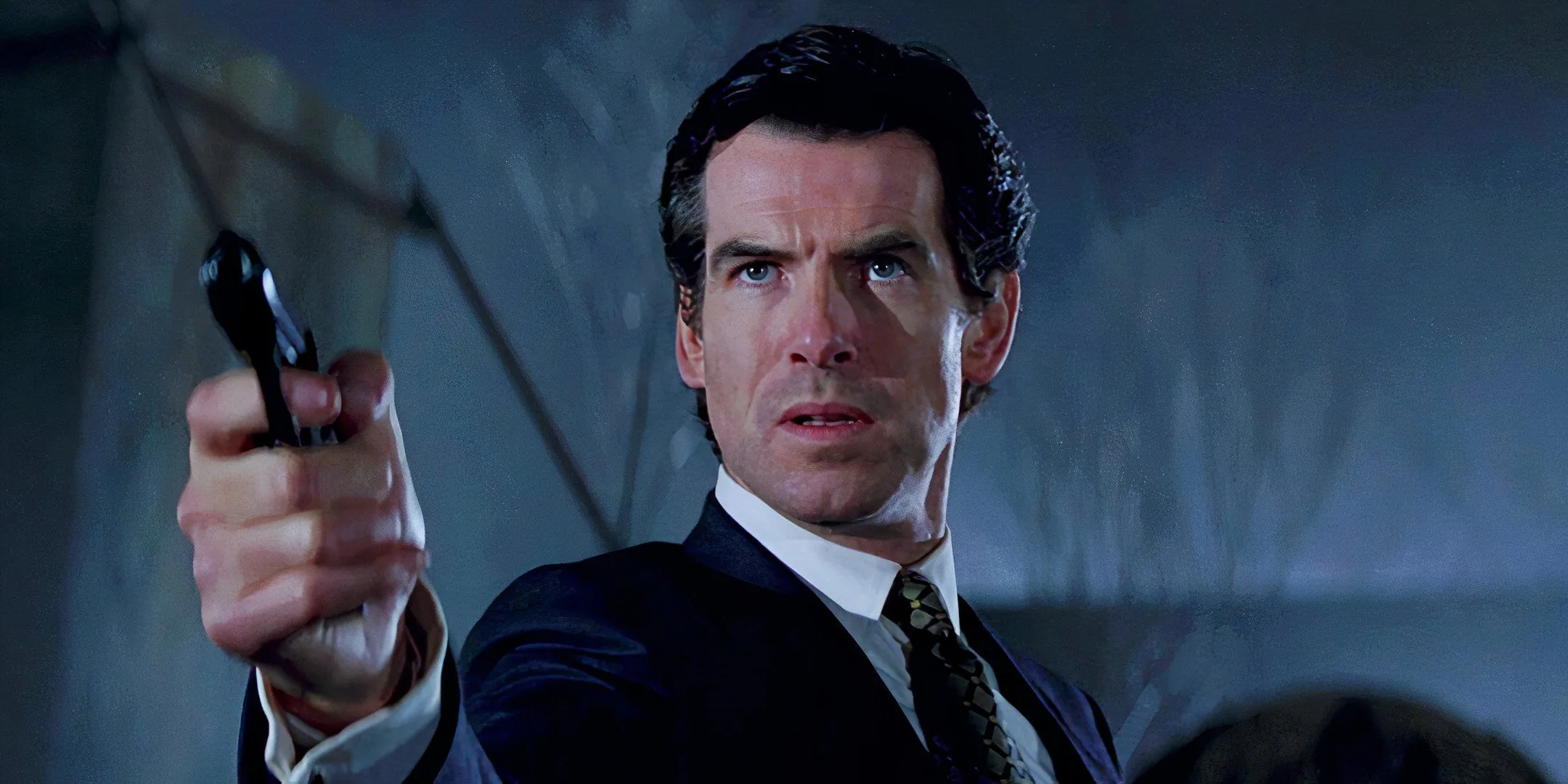 Pierce Brosnan holding a gun and looking confused as James Bond in GoldenEye Pierce Brosnan holding a gun and looking confused as James Bond in GoldenEye