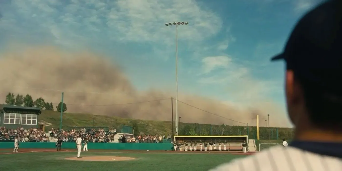 Players standing on a baseball field as a sand storm approaches in Interstellar Players standing on a baseball field as a sand storm approaches in Interstellar