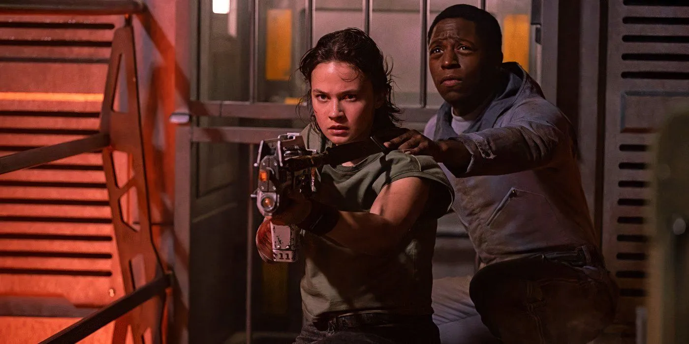 Rain points a gun in Alien: Romulus Rain points a gun in Alien: Romulus