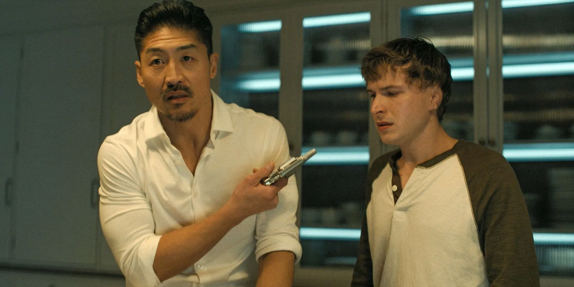 Quinn (Brian Tee) pointing a gun at Richard Beck (Johnny Berchtold) in Reacher Season 3 Ep 6 Quinn (Brian Tee) pointing a gun at Richard Beck (Johnny Berchtold) in Reacher Season 3 Ep 6