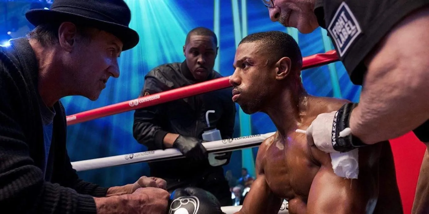 Rocky Balboa giving Adonis Creed instructions in the ring in Creed 2.