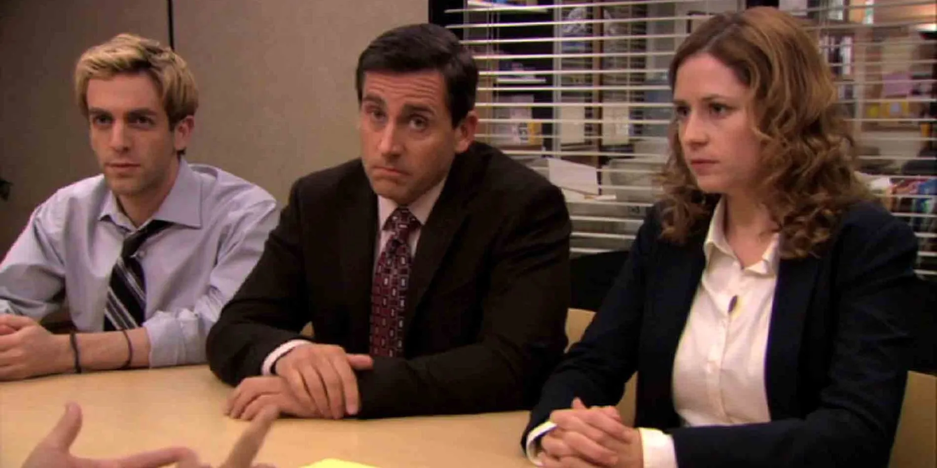 Ryan Michael and Pam sitting at table together negotiating with David Wallace Ryan Michael and Pam sitting at table together negotiating with David Wallace