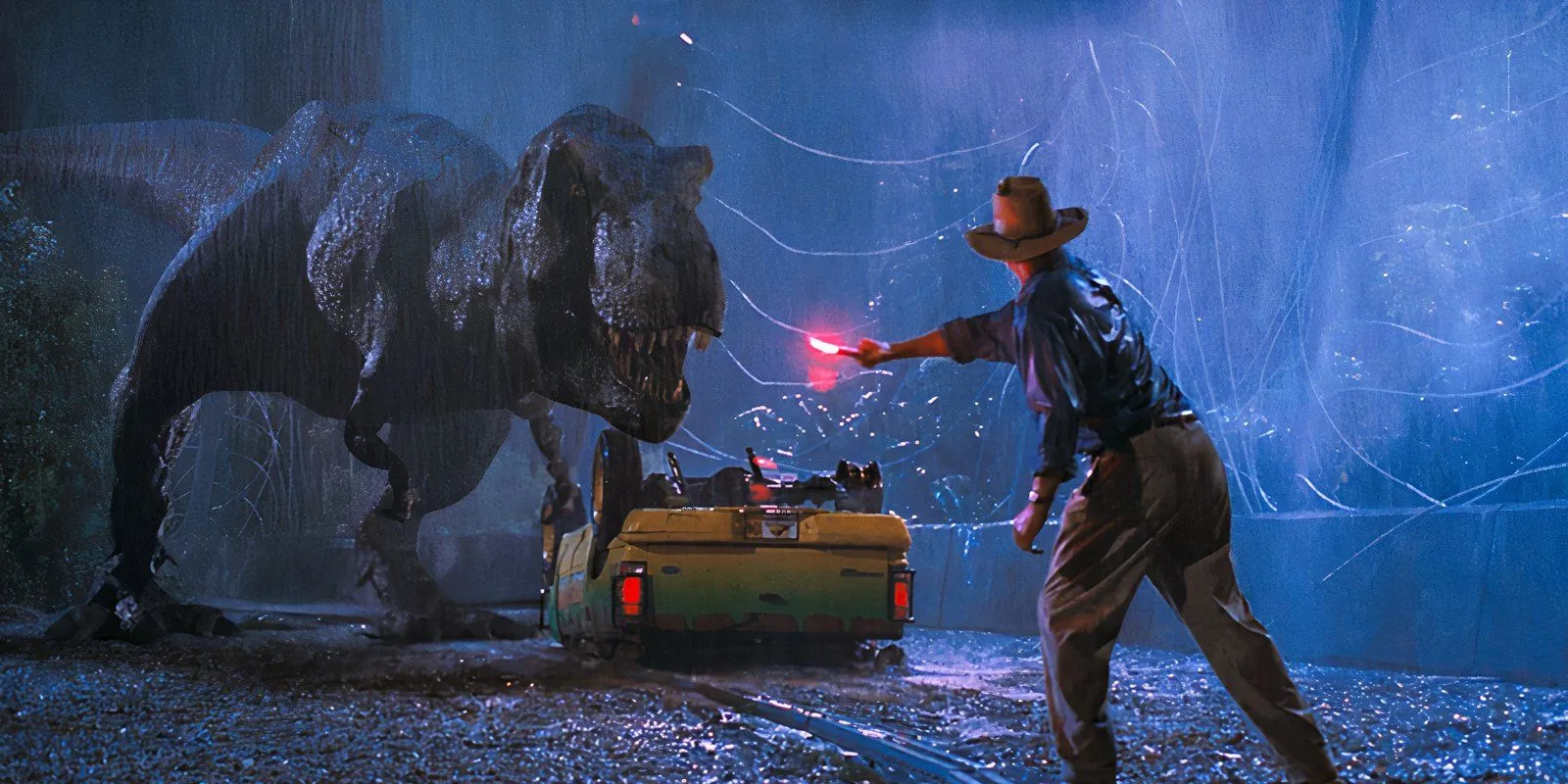 Sam Neill as Alan Grant waving flare