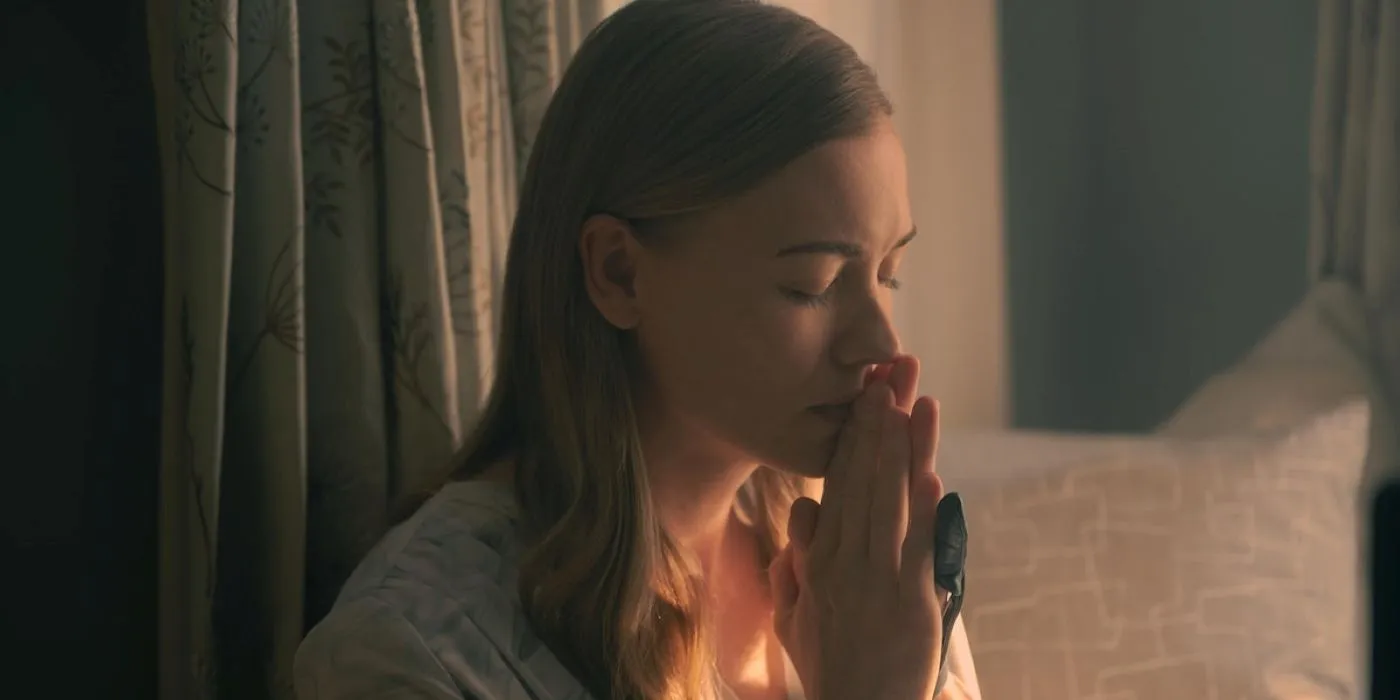 Serena Joy praying