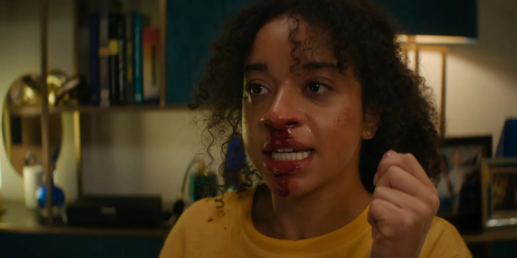 Siena Kelly as Maria holding Verity's pendant while blood drips from her nose in Black Mirror Bete Noire Siena Kelly as Maria holding Verity's pendant while blood drips from her nose in Black Mirror Bete Noire