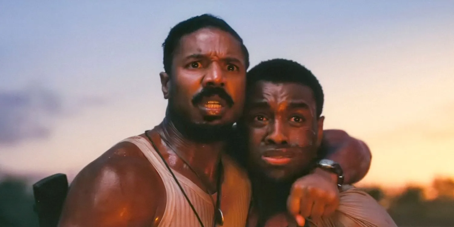 Smoke / Stack (Michael B. Jordan) holding onto Sammie (Miles Caton), looking scared in Sinners