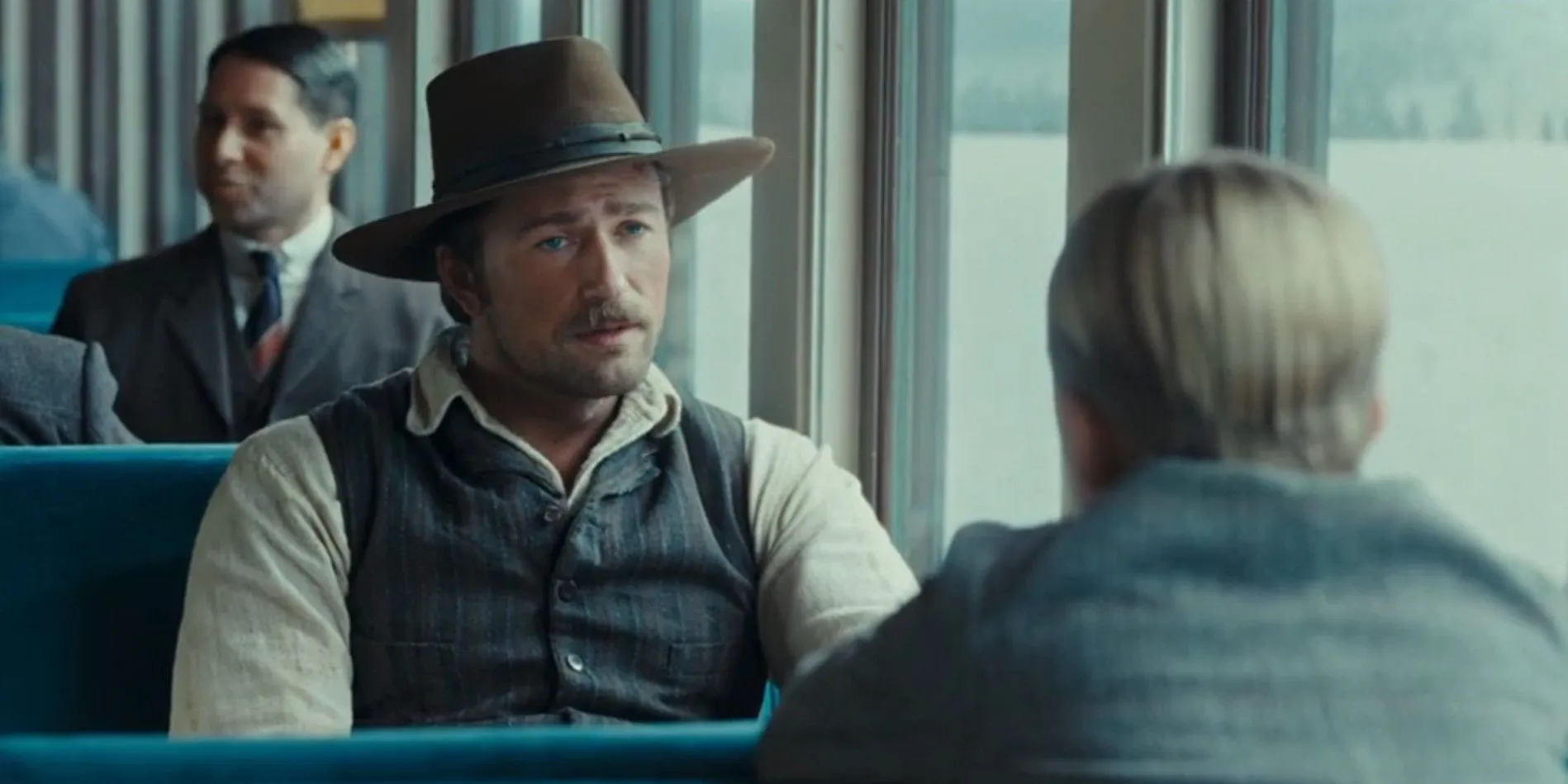 Spencer Dutton talking to a young boy on a train Spencer Dutton talking to a young boy on a train