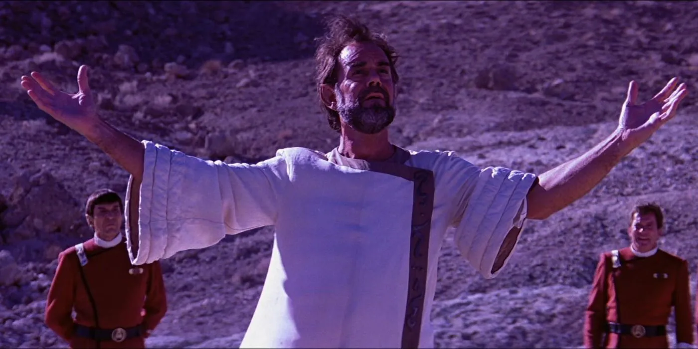 Sybok stands with his arms open on the planet Sha Ka Ree with Kirk and Spock in the background Sybok stands with his arms open on the planet Sha Ka Ree with Kirk and Spock in the background