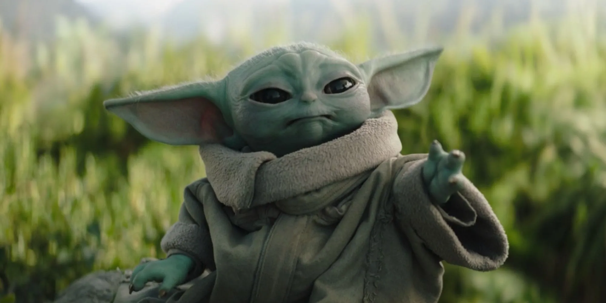 Grogu reaching out his hand