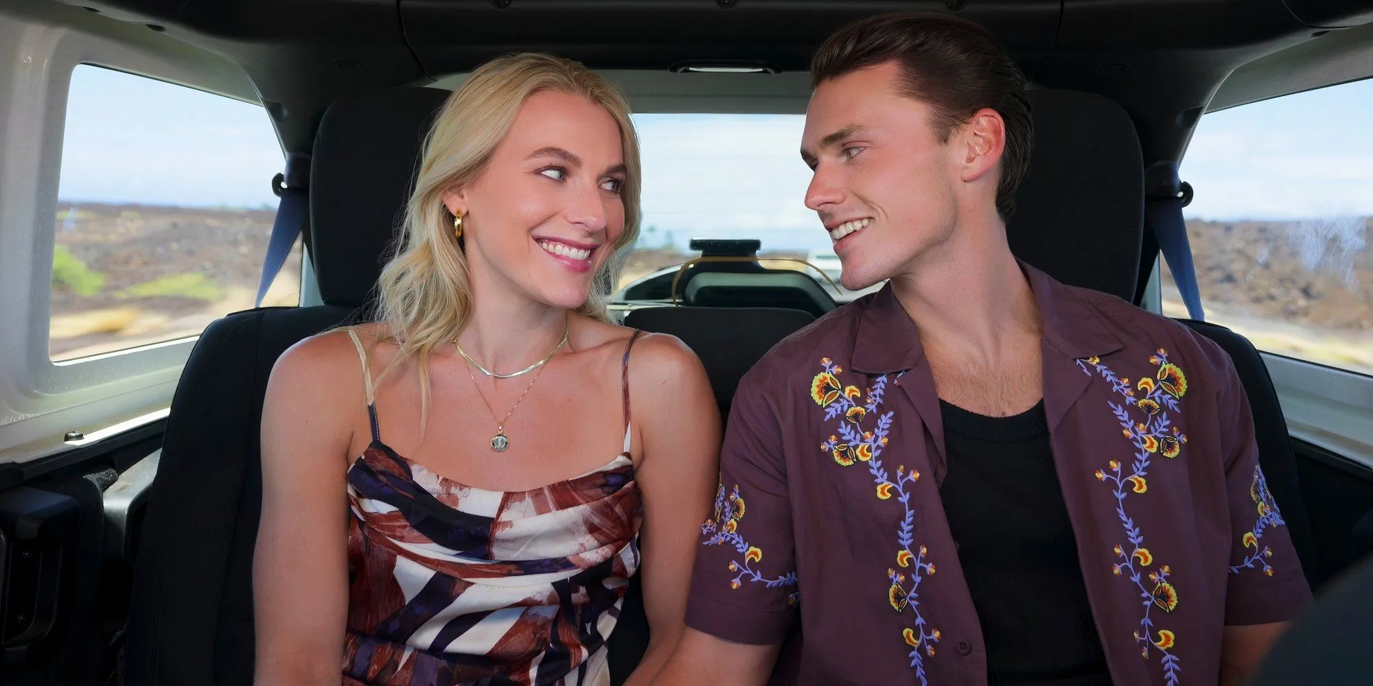 Tayler and Tyler smiling in a car