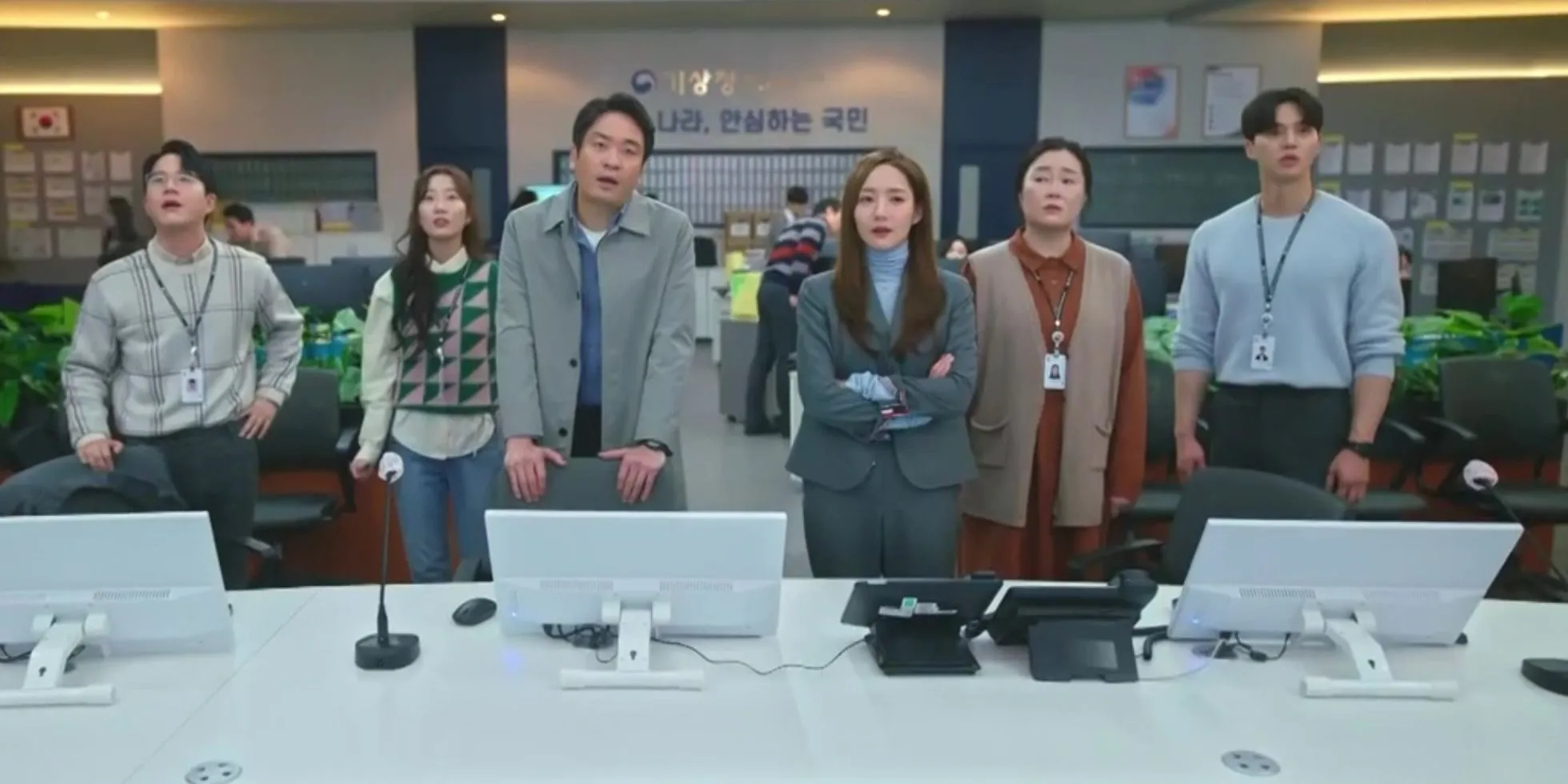 The cast of Forecasting Love and Weather in their office