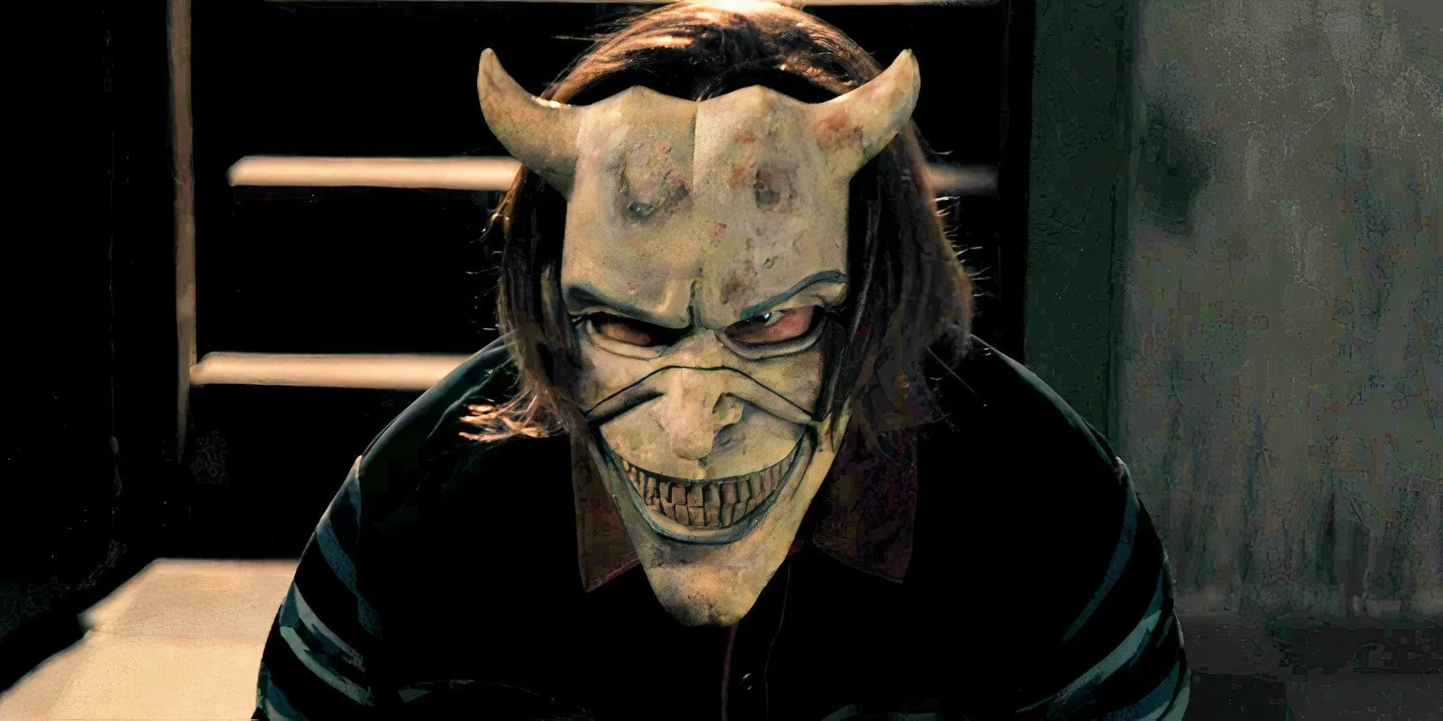 The Grabber with a mask in The Black Phone The Grabber with a mask in The Black Phone