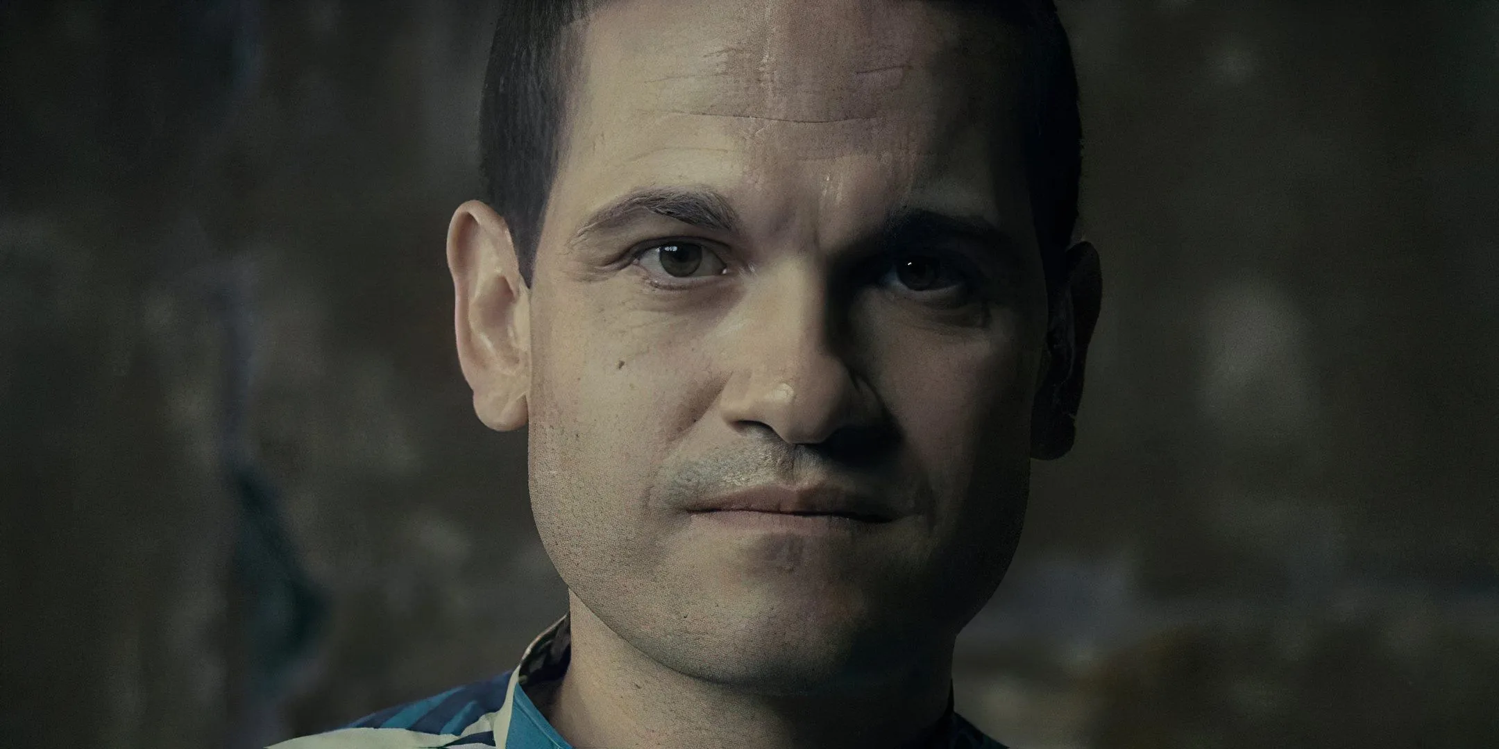 A man looks into the camera. A man looks into the camera.