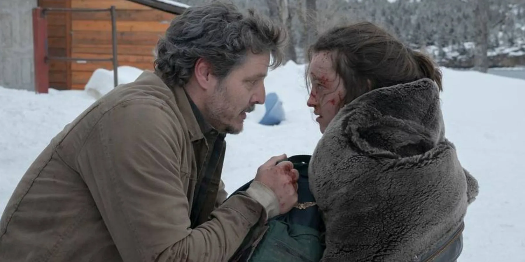 Joel and Ellie in the snow in The Last of Us Joel and Ellie in the snow in The Last of Us