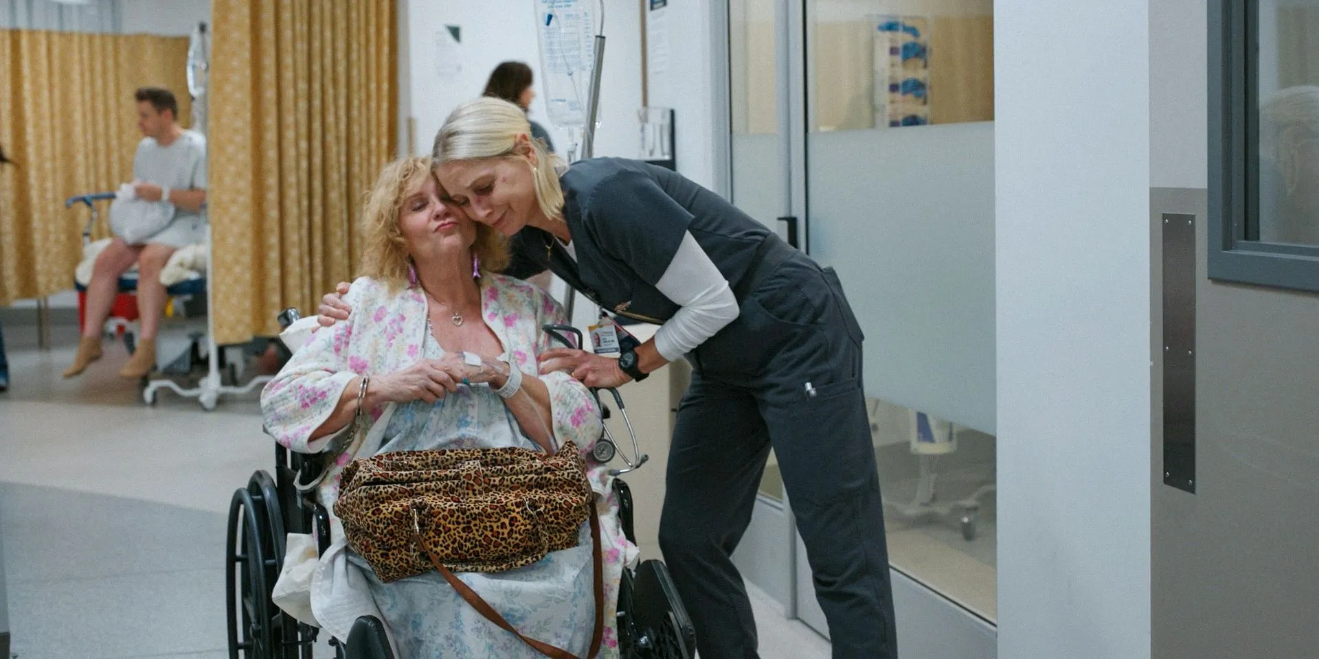Nurse Dana Evans (Katherine LaNasa) embracing Myrna (Jeanette O'Connor) in The Pitt Season 1 Episode 10