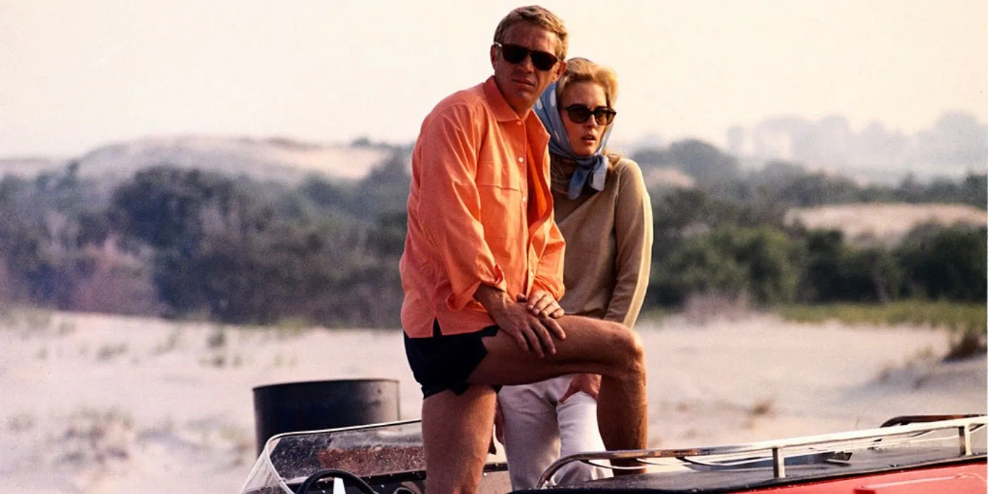 Steve McQueen and Faye Dunaway stand together on a boat in The Thomas Crown Affair