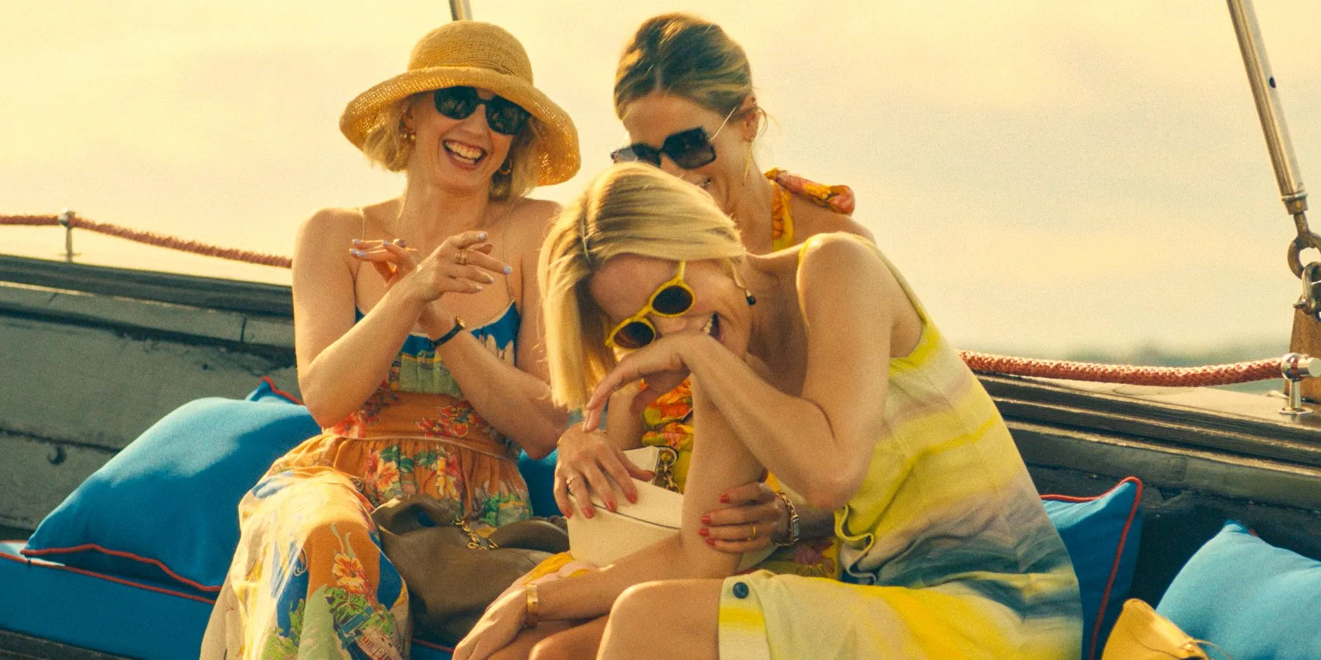 Laurie (Carrie Coon), Jaclyn Lemon (Michelle Monaghan), and Kate (Leslie Bibb) having fun on the boat on their way to the hotel in The White Lotus Season 3 Ep 1 Laurie (Carrie Coon), Jaclyn Lemon (Michelle Monaghan), and Kate (Leslie Bibb) having fun on the boat on their way to the hotel in The White Lotus Season 3 Ep 1