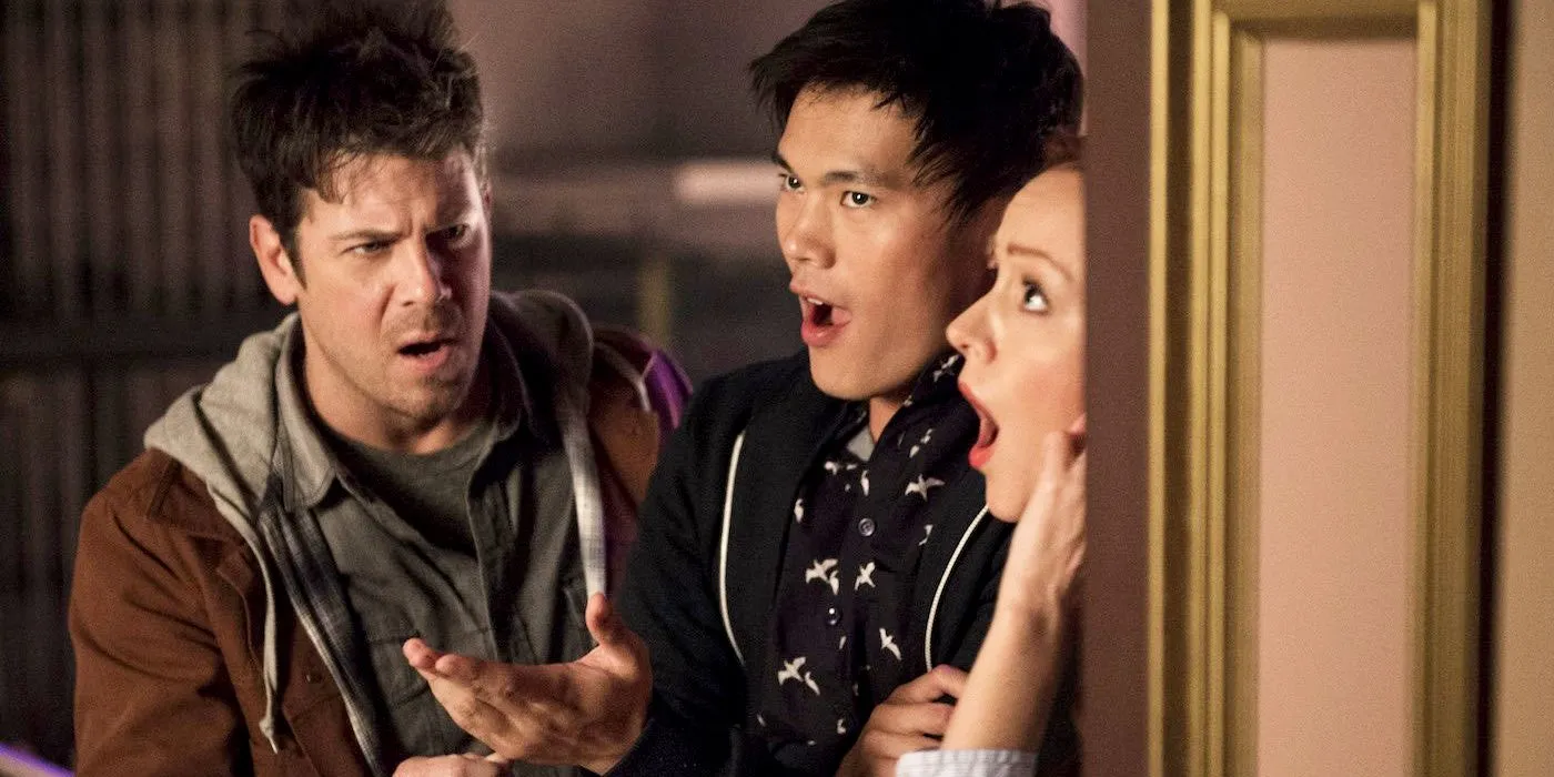 Three Characters with Open Mouths Behind a Doorway in The Librarians