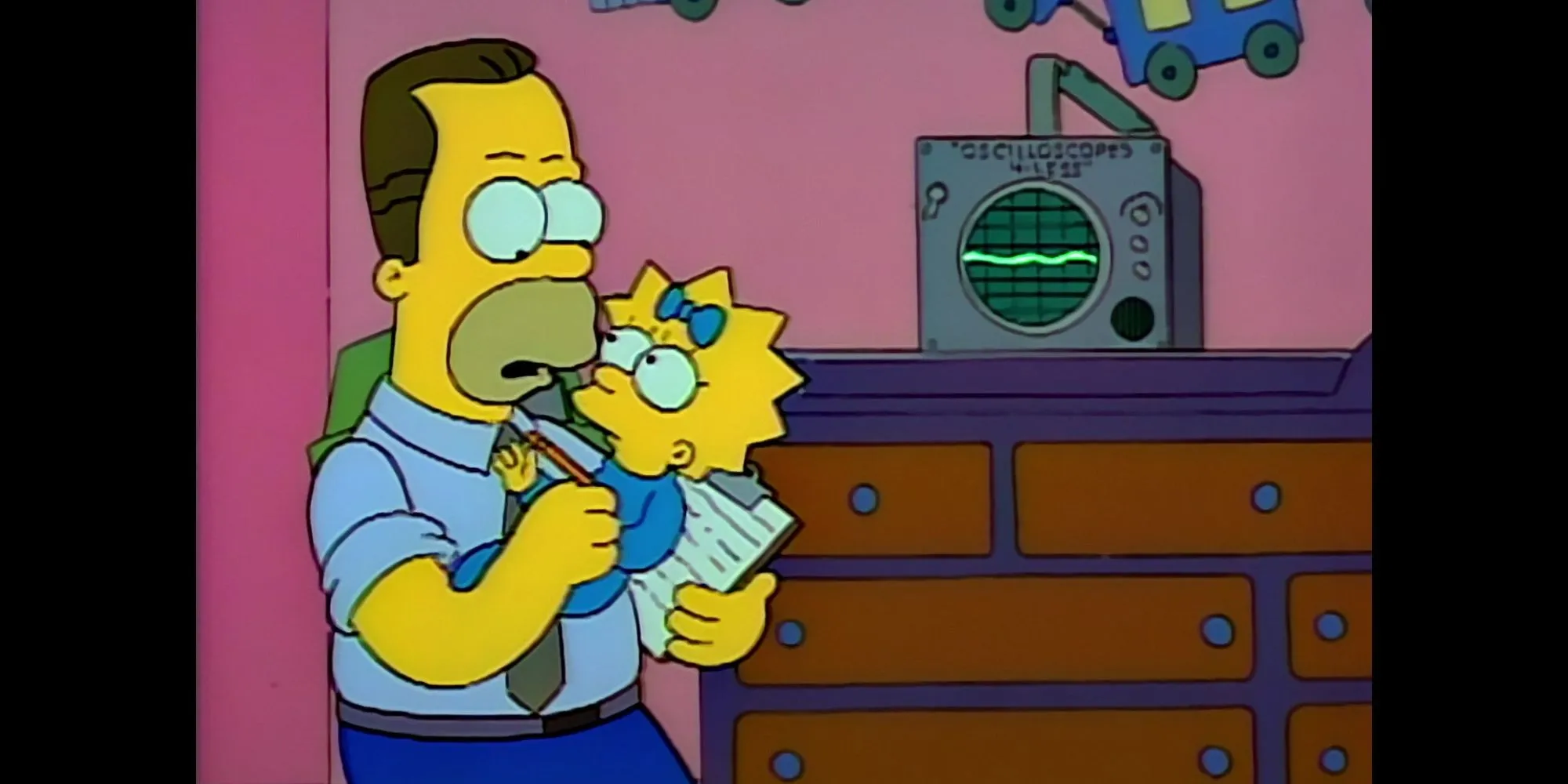 Herb Powell holds Maggie Simpson while taking notes with baby translator on the dresser Herb Powell holds Maggie Simpson while taking notes with baby translator on the dresser