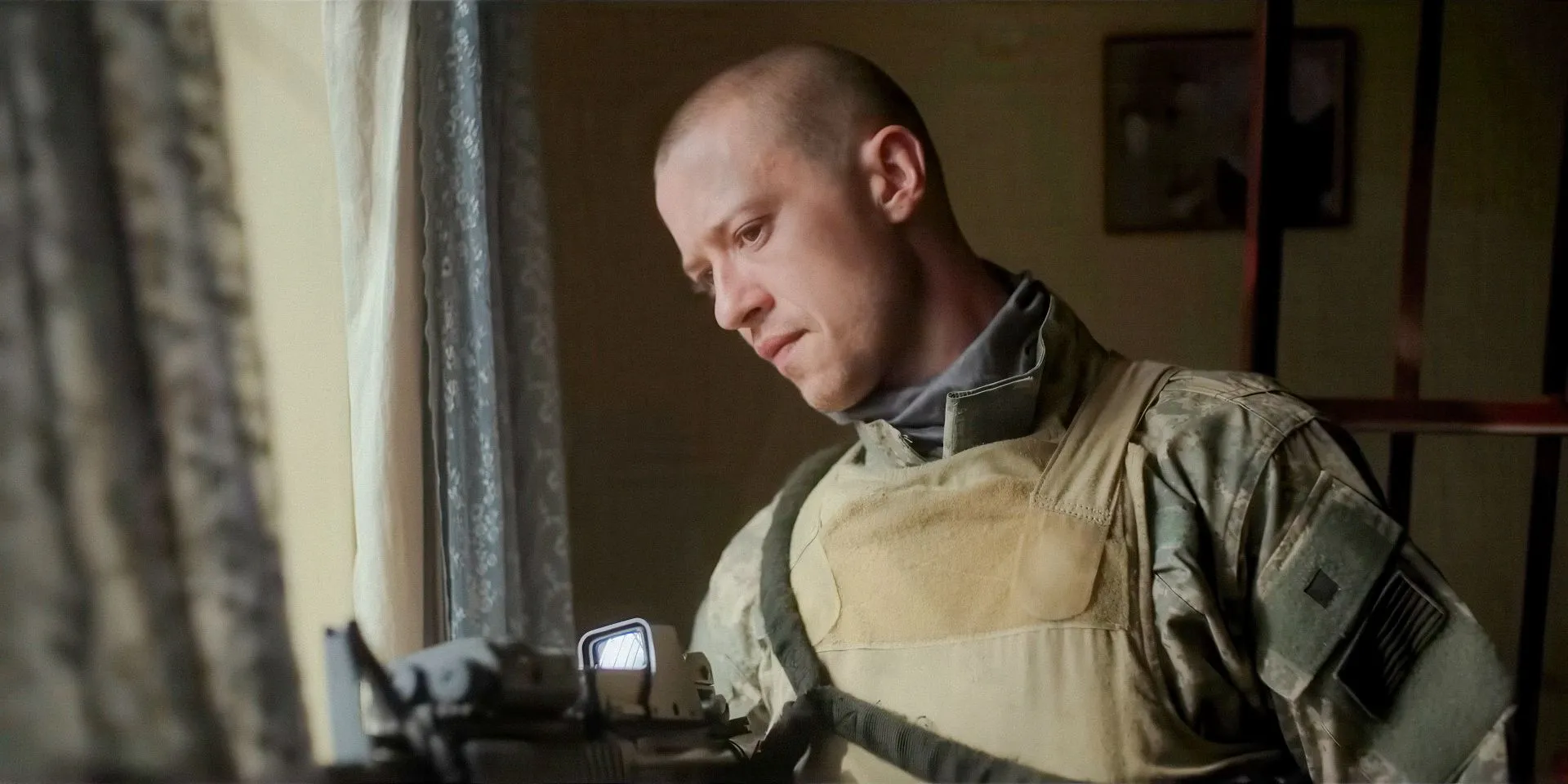Character from Warfare looking out the window