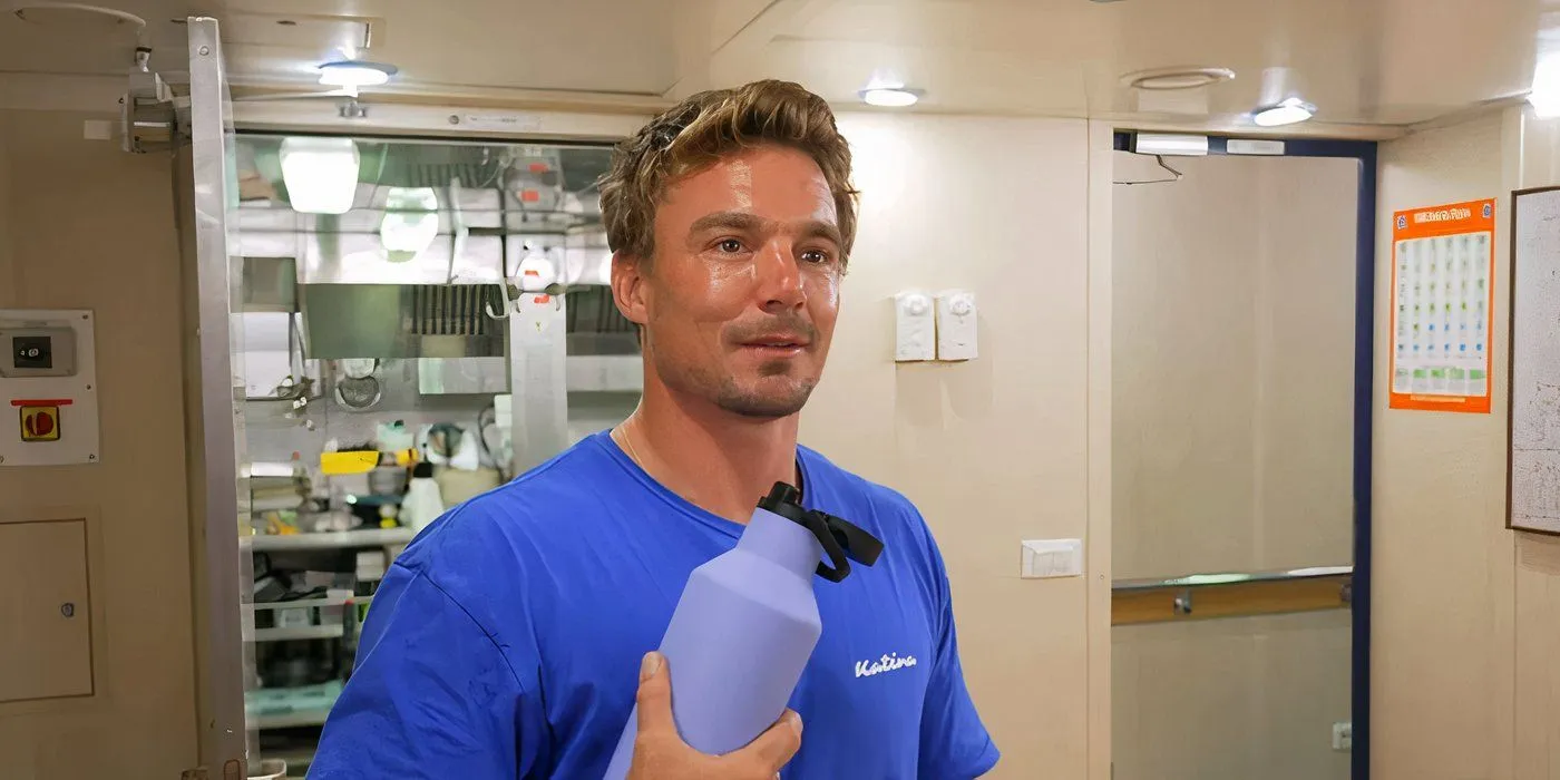 Wihan du Toit holding a water bottle in the galley