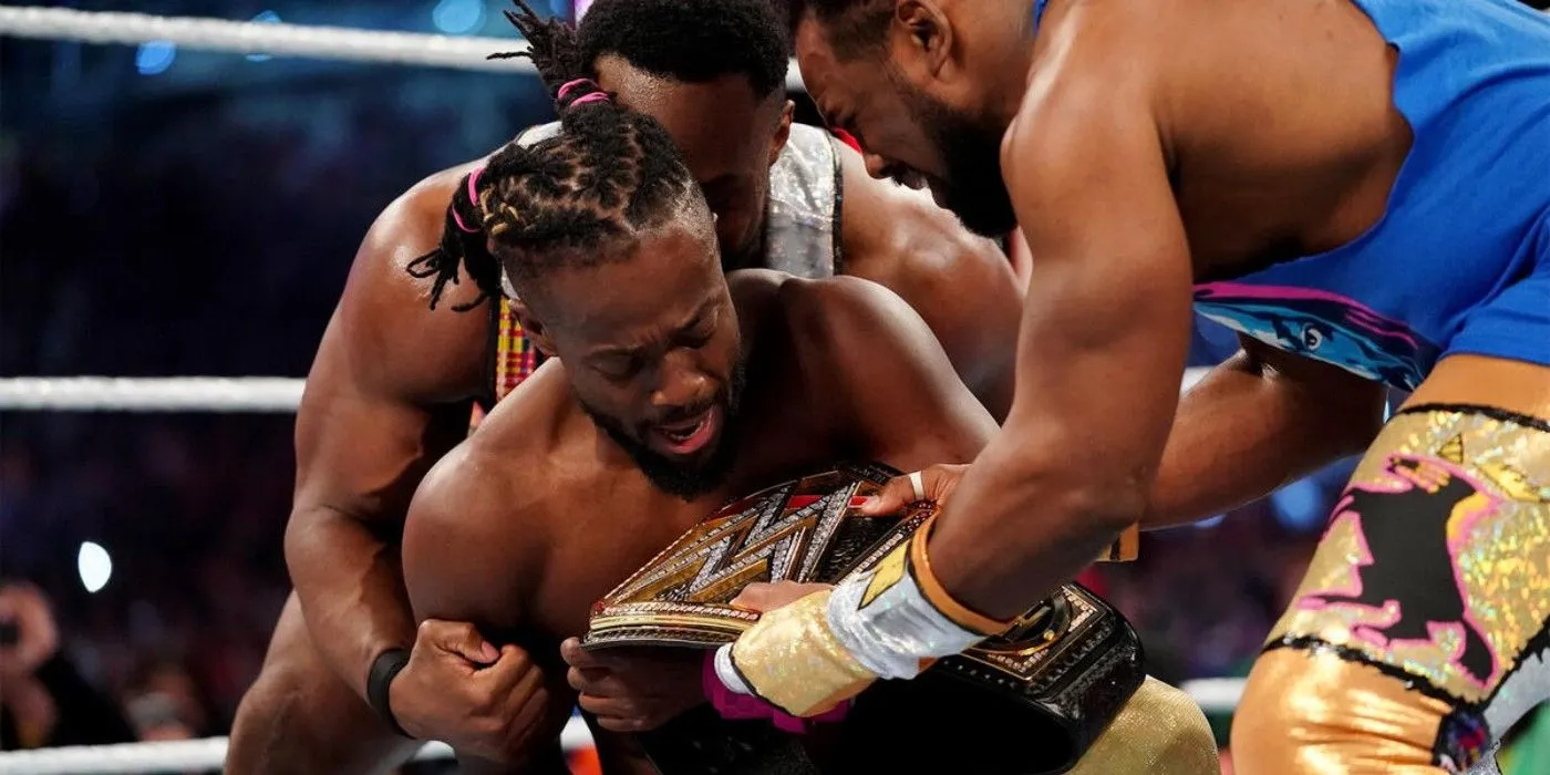 Xavier Woods and Big E hand Kofi Kingston the WWE Championship at WrestleMania 35 Xavier Woods and Big E hand Kofi Kingston the WWE Championship at WrestleMania 35