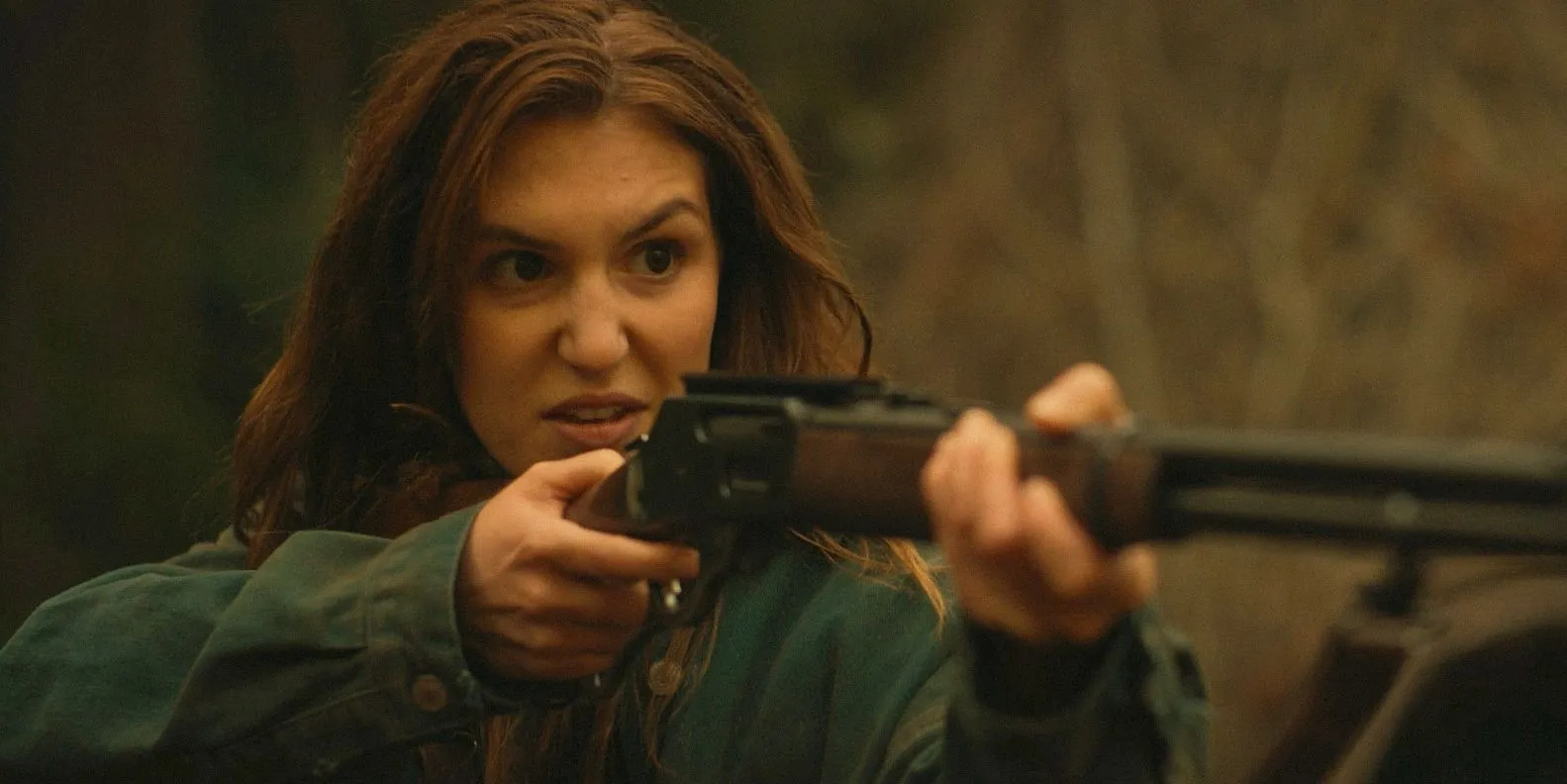 Teen Shauna looking furious and aiming a gun in Yellowjackets season 3, episode 9 Teen Shauna looking furious and aiming a gun in Yellowjackets season 3, episode 9