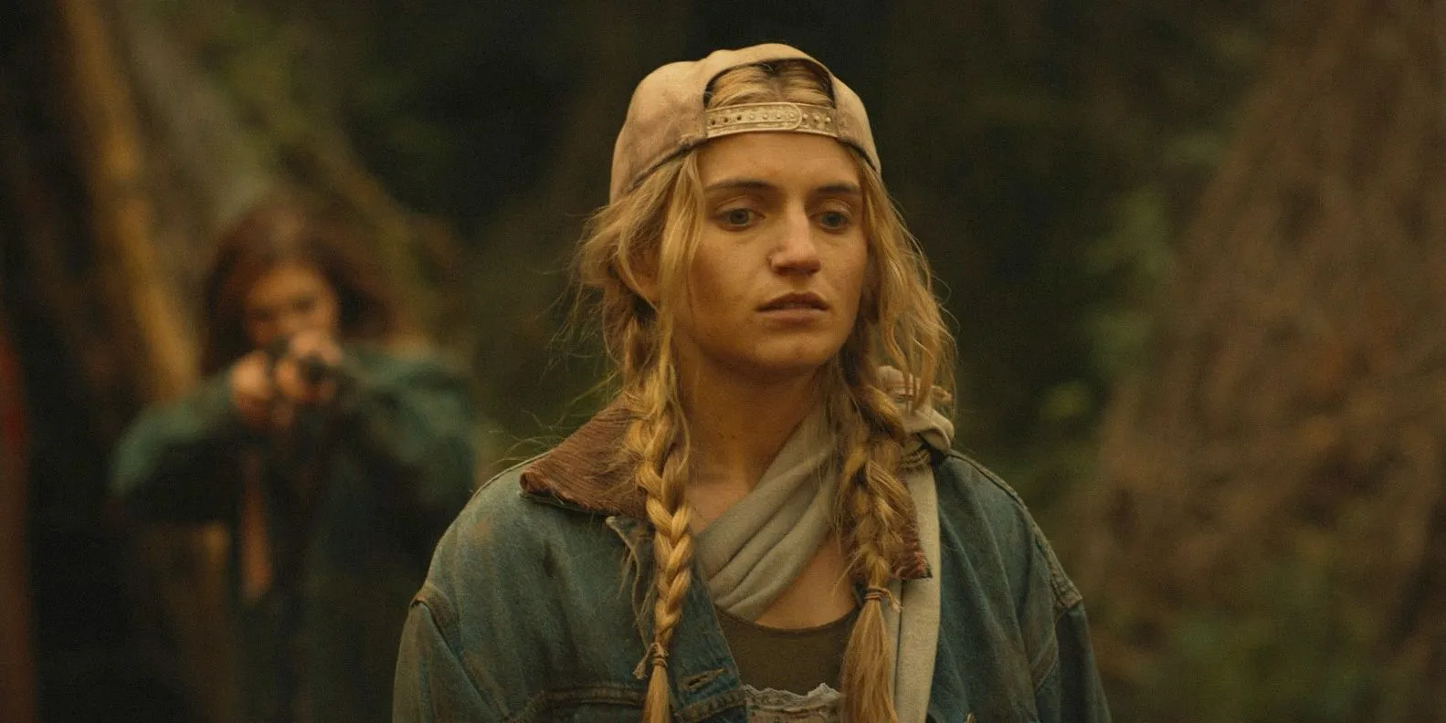 Teen Melissa with a gun pointed at her back in Yellowjackets season 3, episode 9