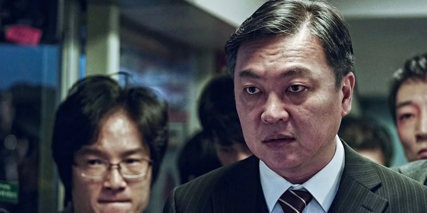 Yon-suk looks on dramatically in Train To Busan (2016) Yon-suk looks on dramatically in Train To Busan (2016)