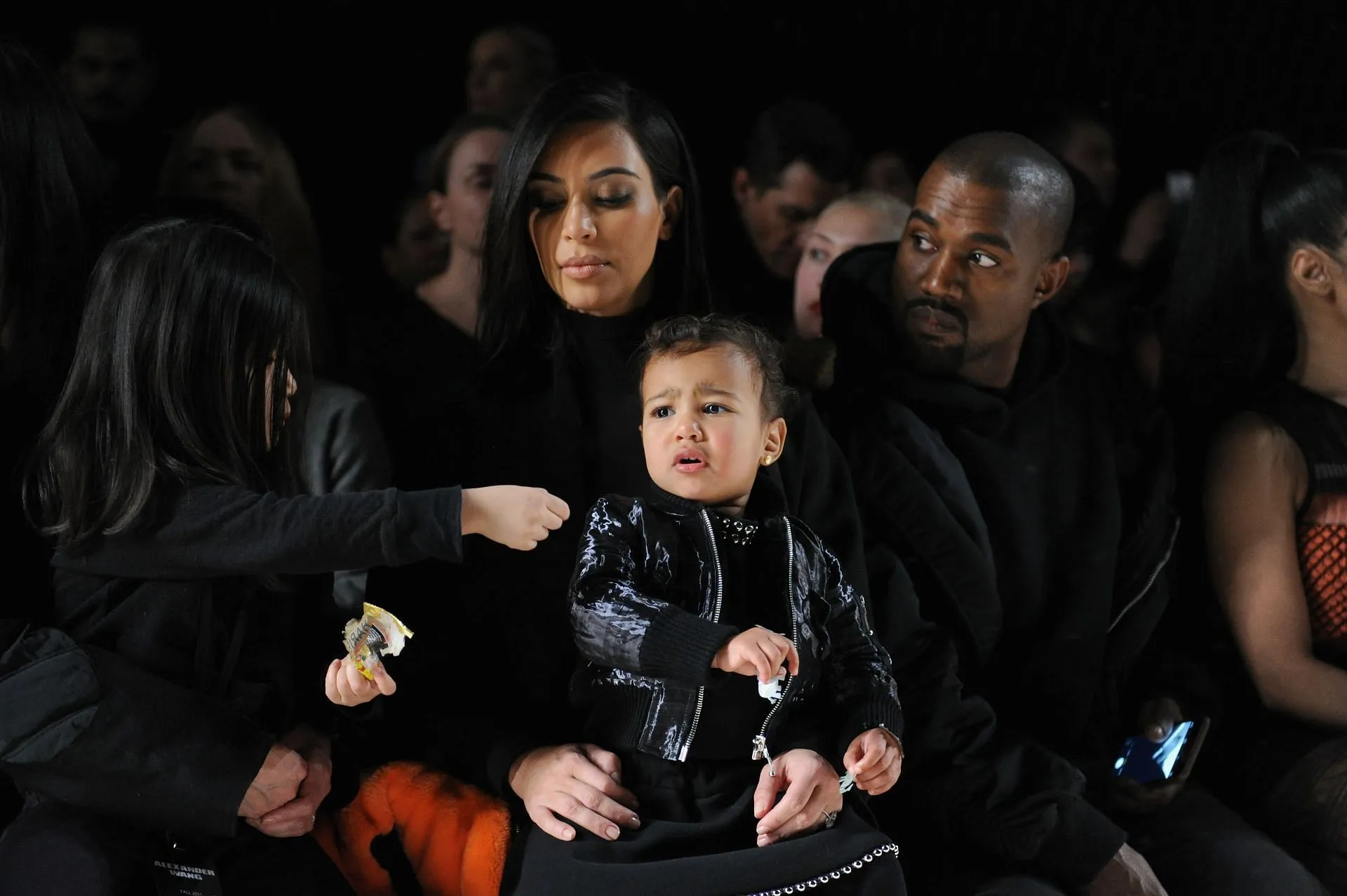 Kanye West and Kim Kardashian with their daughter North West attending the Alexander Wang show - Front Row - Mercedes-Benz Fashion Week Fall 2015 (Image via Getty)
