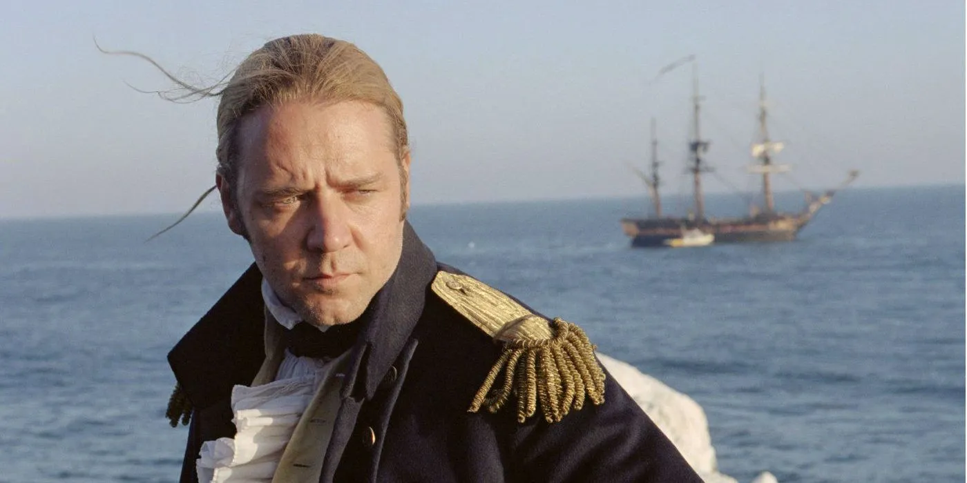 Russell Crowe pausing aboard a ship in Master and Commander