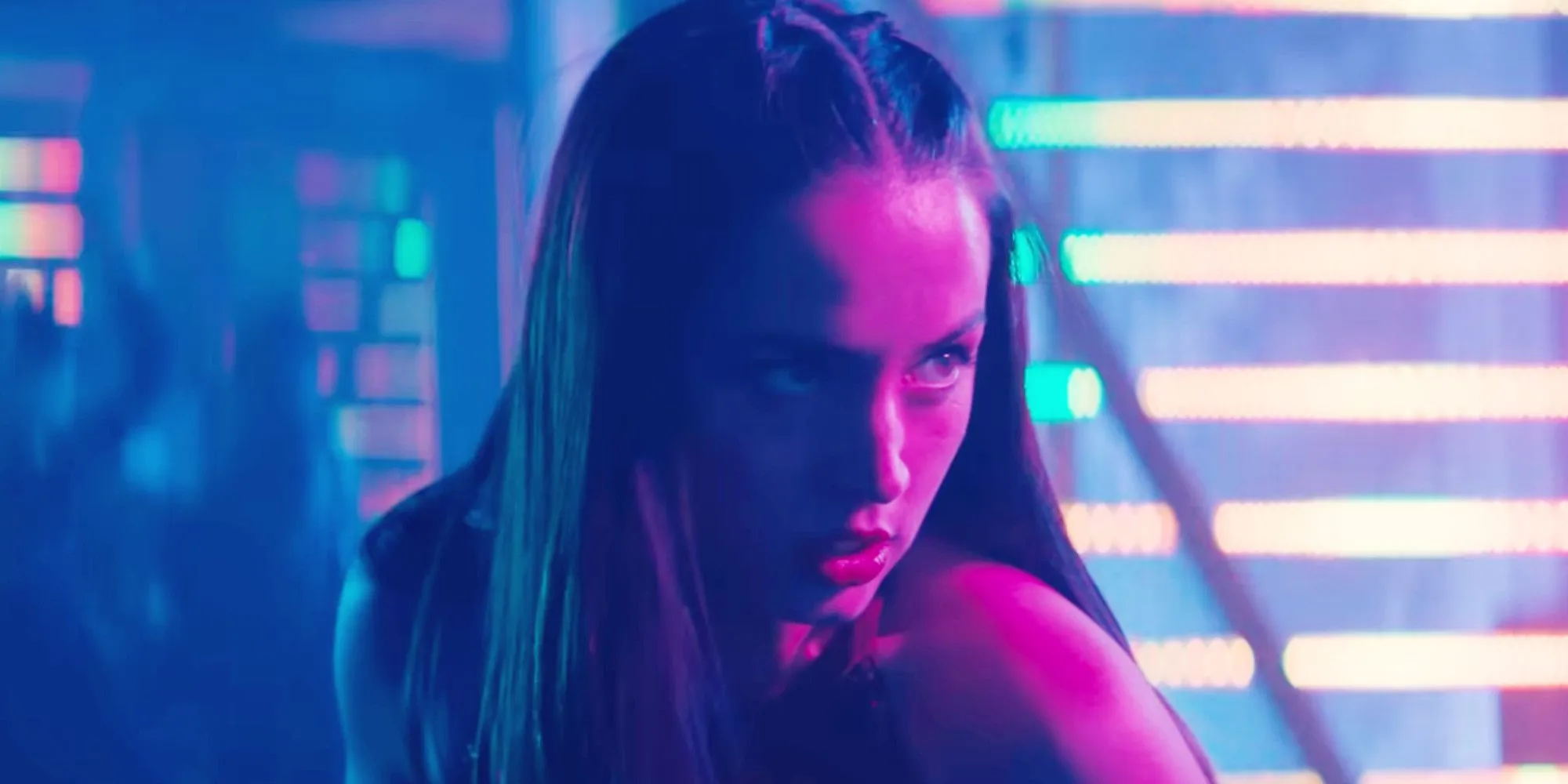 Ana de Armas in an intense pose with dramatic lighting showcasing her character in Ballerina