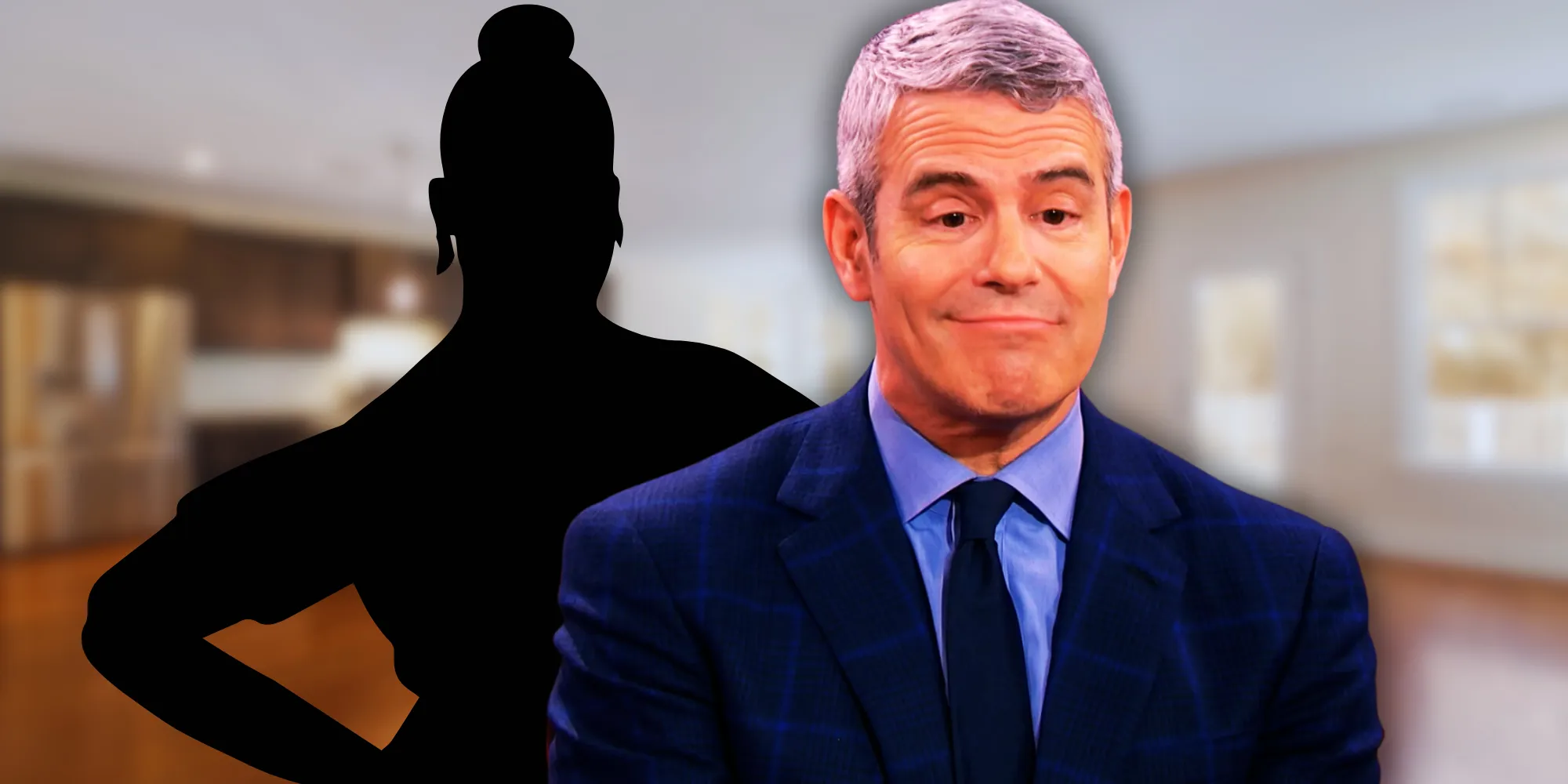 Andy Cohen making a funny face with a mystery person in the background Andy Cohen making a funny face with a mystery person in the background