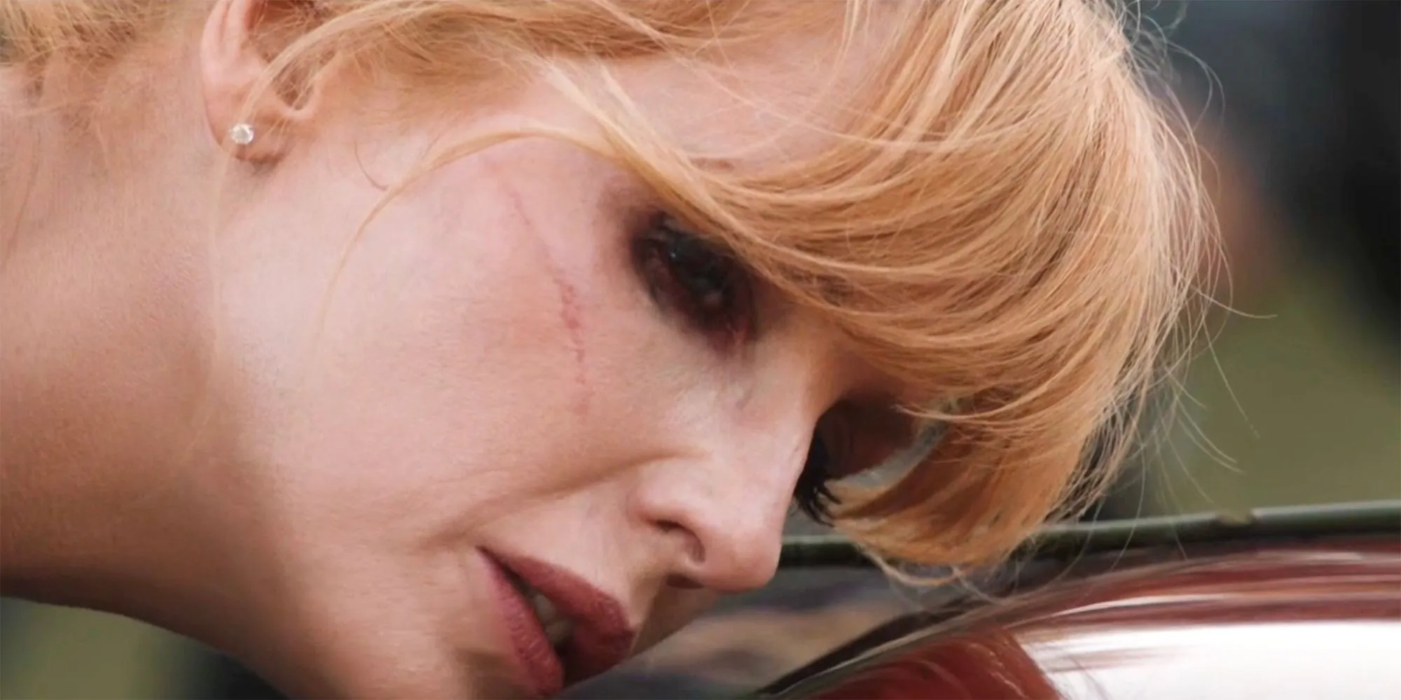 Beth whispering to John Dutton's coffin in Yellowstone