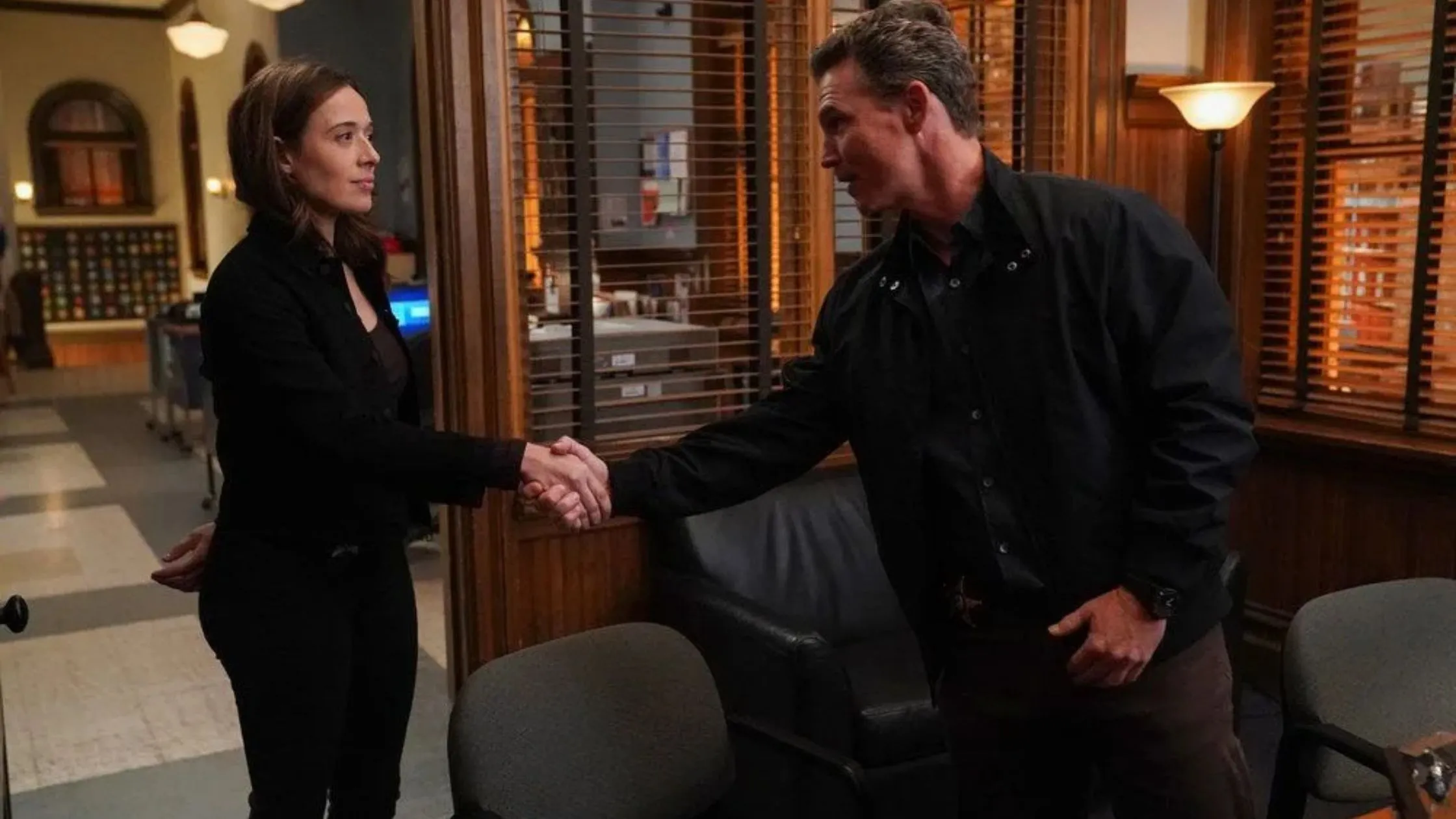 Chicago PD: Burgess and Reid shaking hands in Hank's office Chicago PD: Burgess and Reid shaking hands in Hank's office