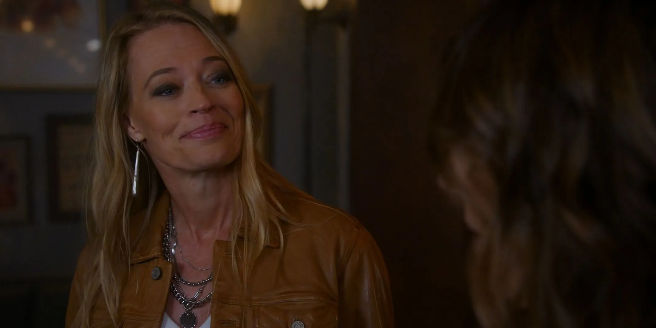 Tara smiling curiously at Sophie in Leverage: Redemption Tara smiling curiously at Sophie in Leverage: Redemption