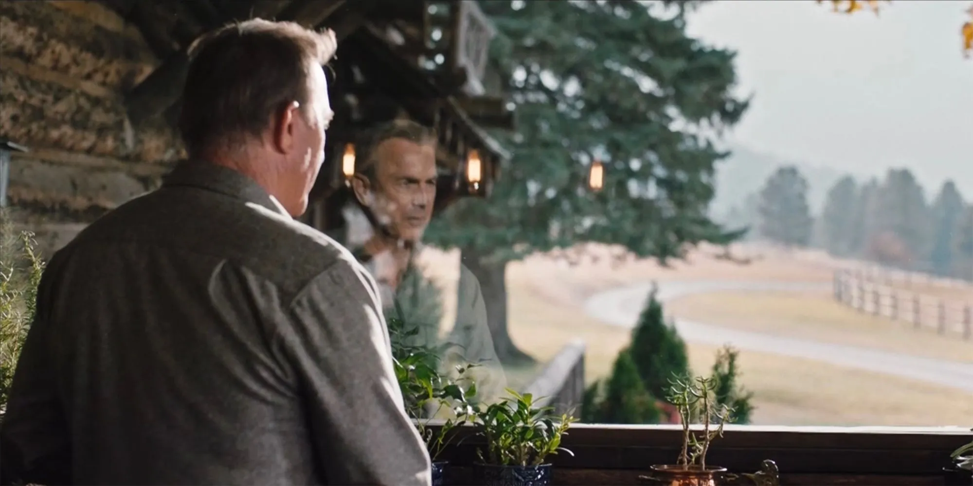John Dutton looking out the window in Yellowstone