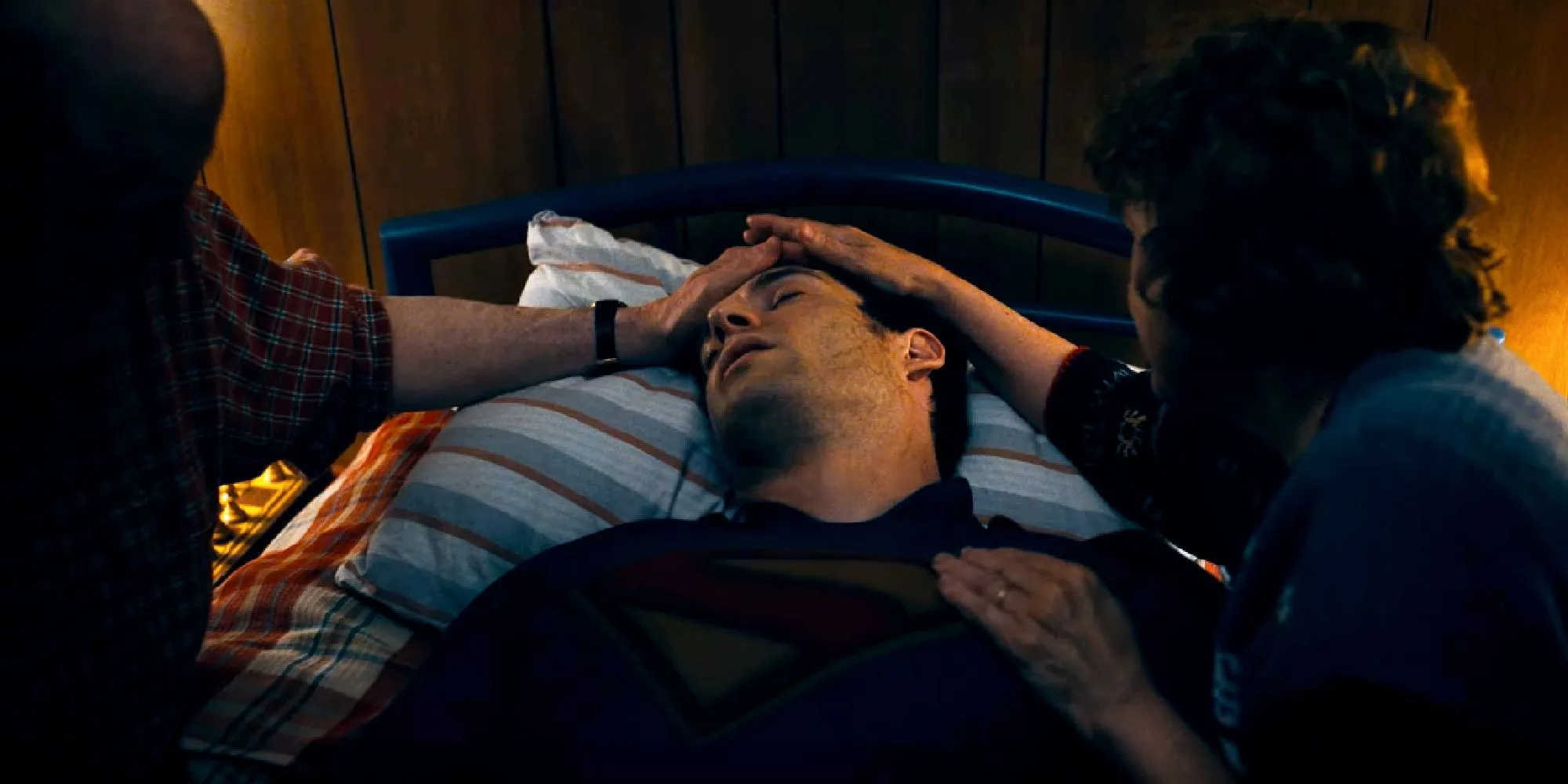 Ma and Pa Kent caring for an injured Clark Kent in James Gunn's Superman