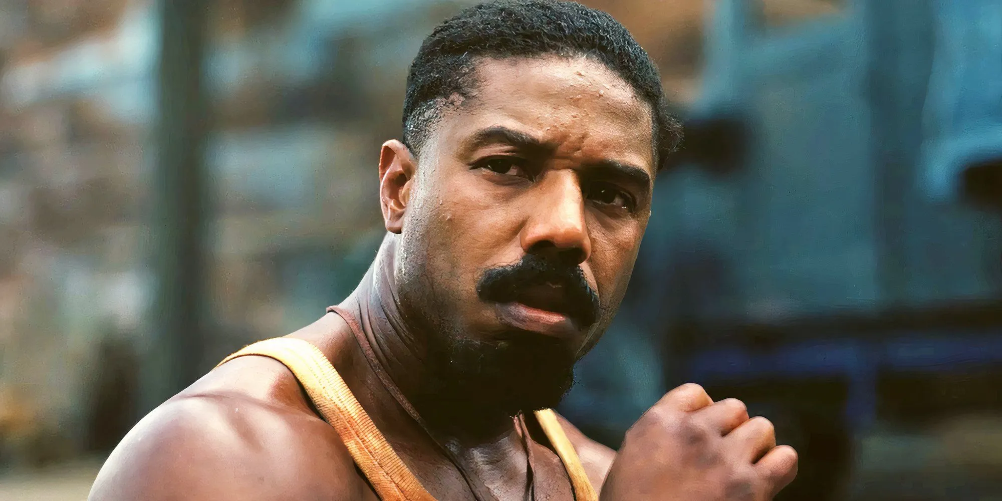Michael B. Jordan as Smoke looking intense in Sinners Michael B. Jordan as Smoke looking intense in Sinners