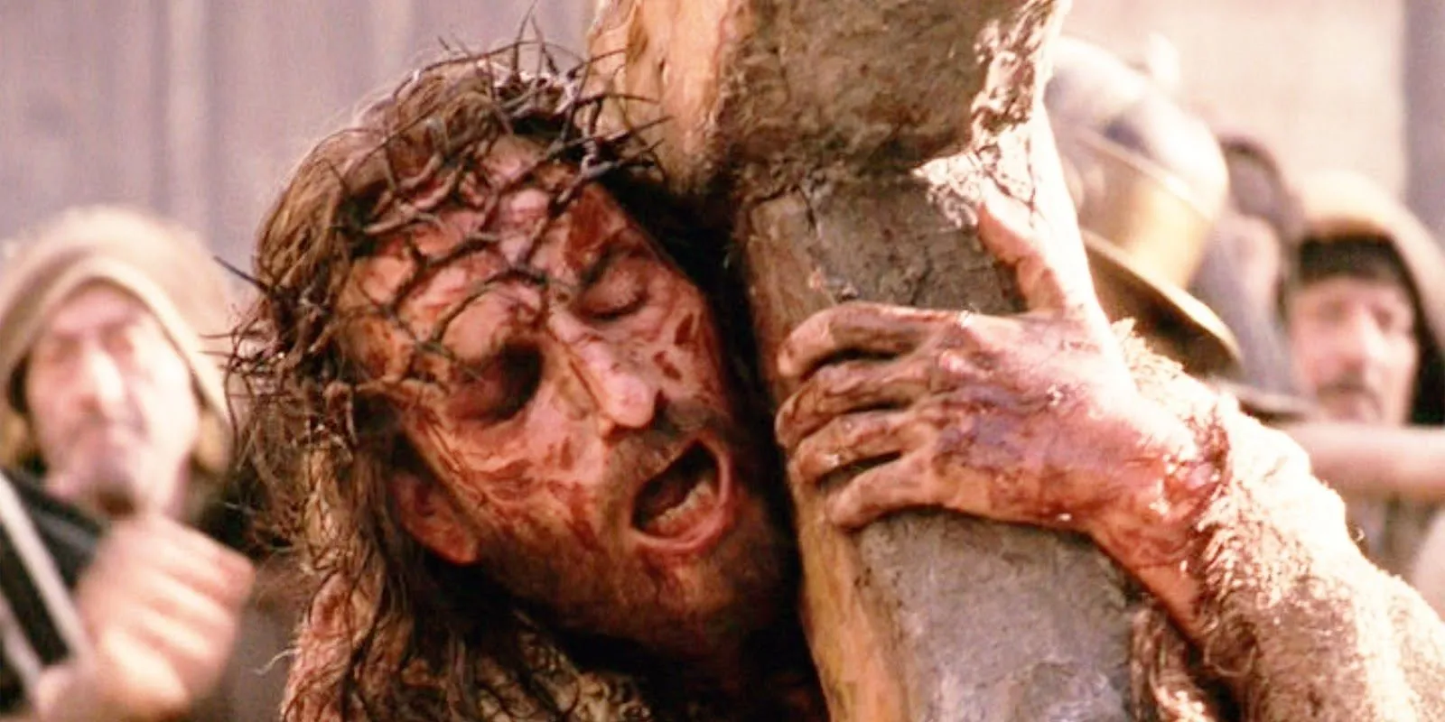 Jesus weeps while carrying the cross in Passion of the Christ
