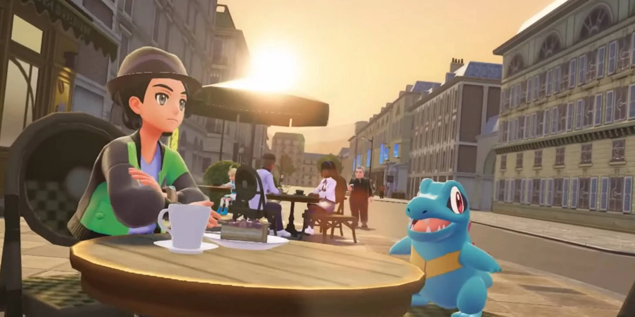 A trainer with their Totodile in a café in Pokémon Legends Z-A. A trainer with their Totodile in a café in Pokémon Legends Z-A.