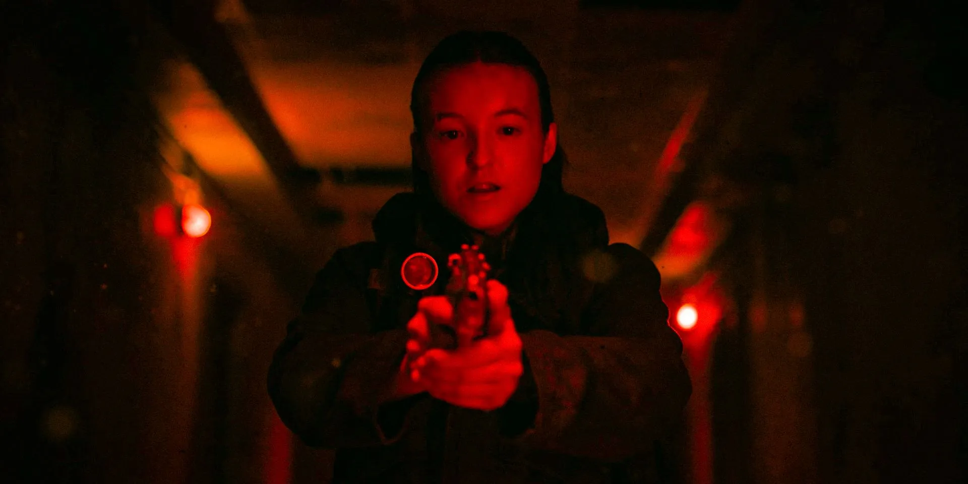 Ellie Williams (Bella Ramsey) pointing her pistol in The Last of Us Season 2 Ep 5 Ellie Williams (Bella Ramsey) pointing her pistol in The Last of Us Season 2 Ep 5