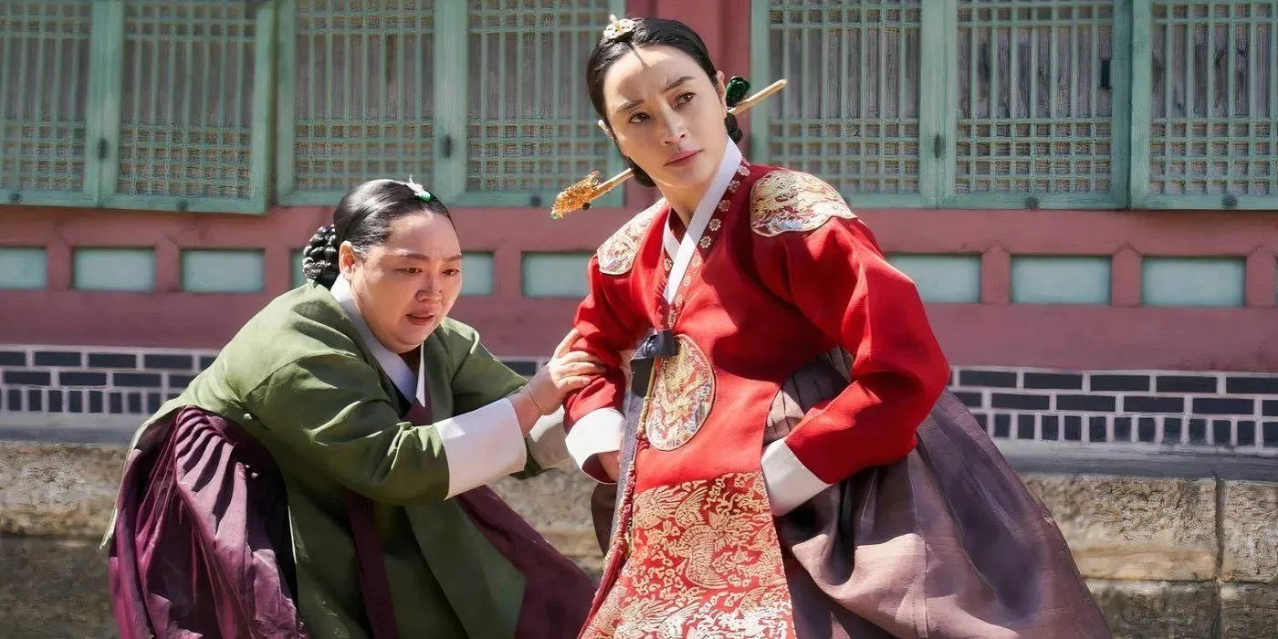 A still image showing two characters in period costumes in Under The Queen’s Umbrella A still image showing two characters in period costumes in Under The Queen’s Umbrella